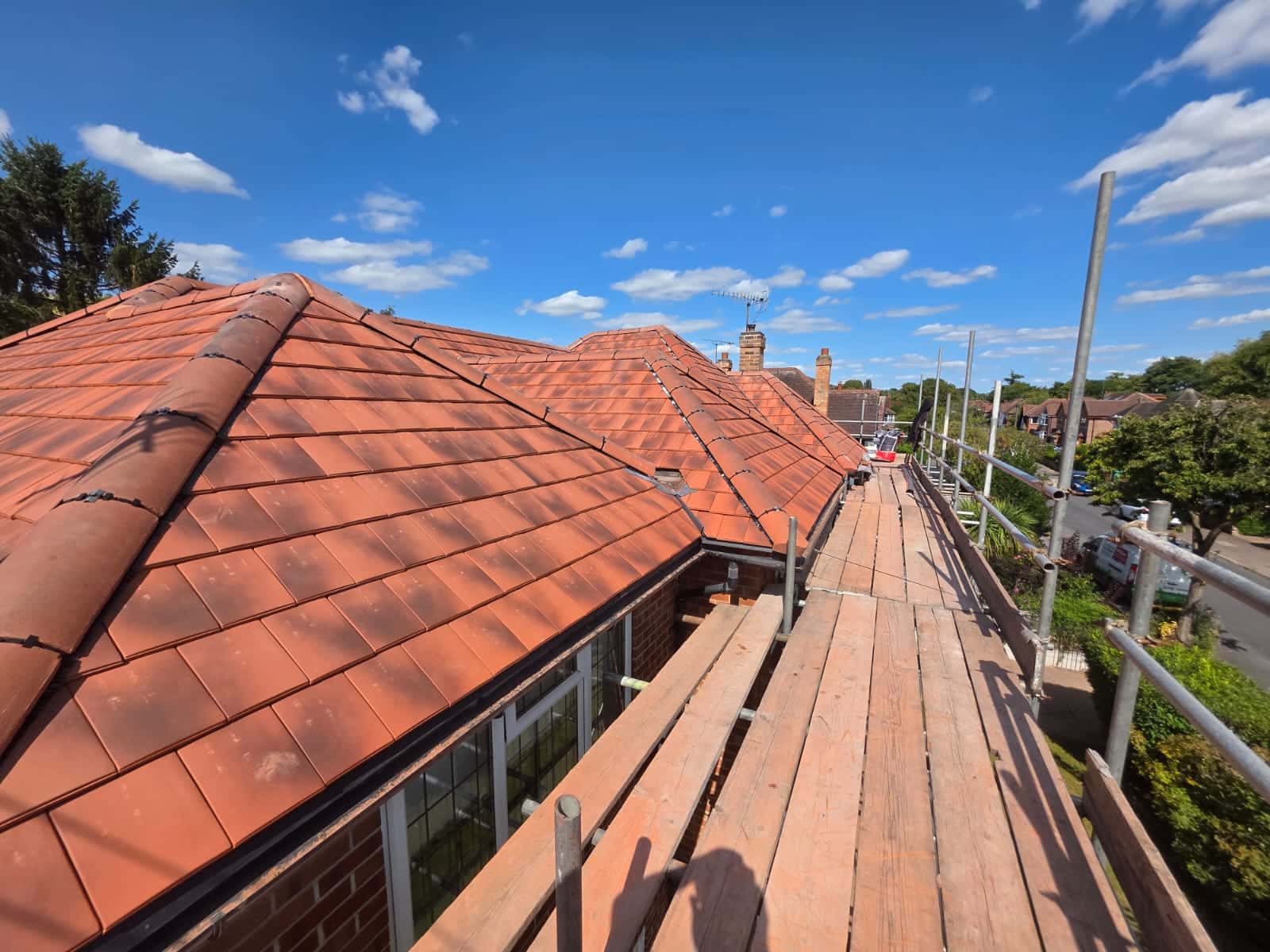 Completed red tiled pitched roof by WeatherTech Roofing