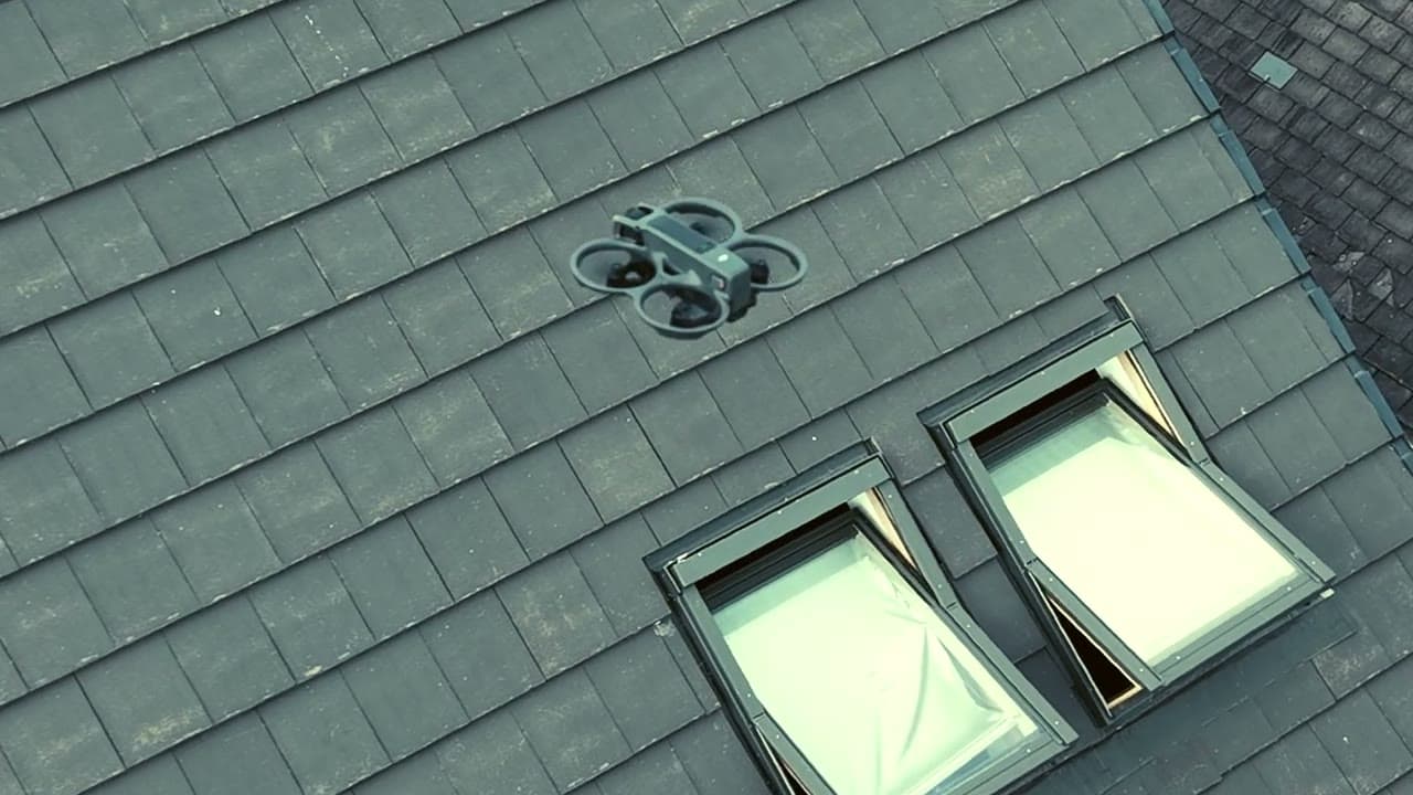 Drone hovering above a pitched roof during a WeatherTech roof survey