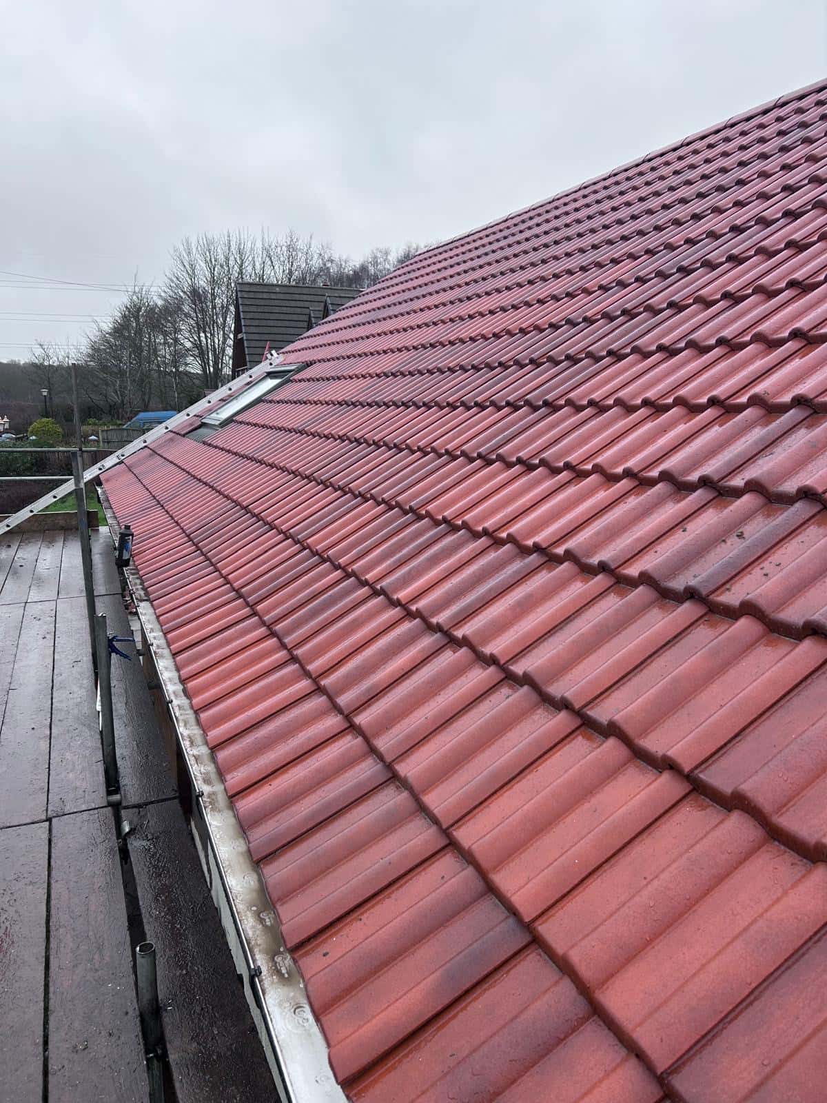 Completed pitched roof with red tiles by WeatherTech Roofing