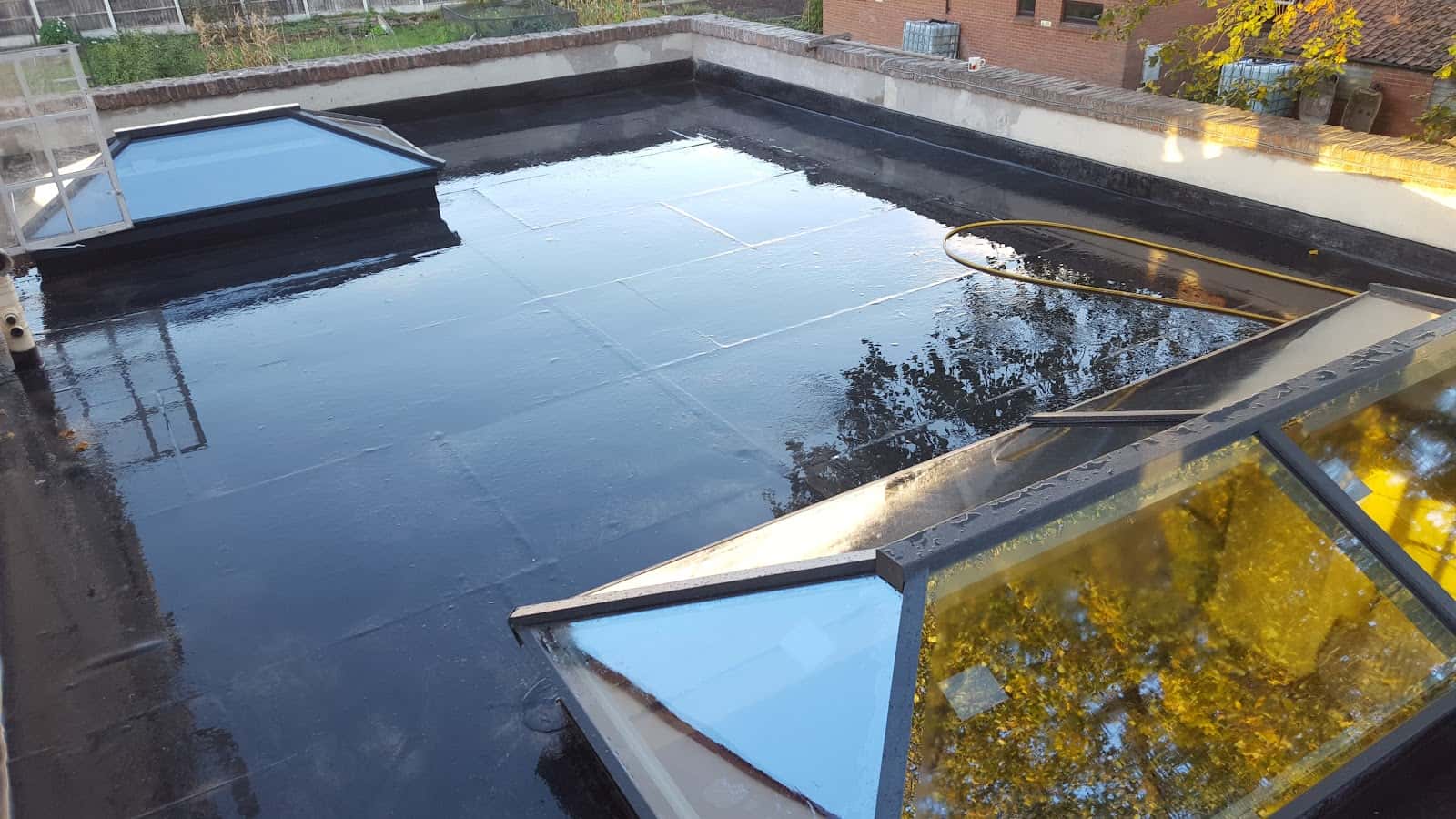 Flat roof with rooflights by WeatherTech Roofing
