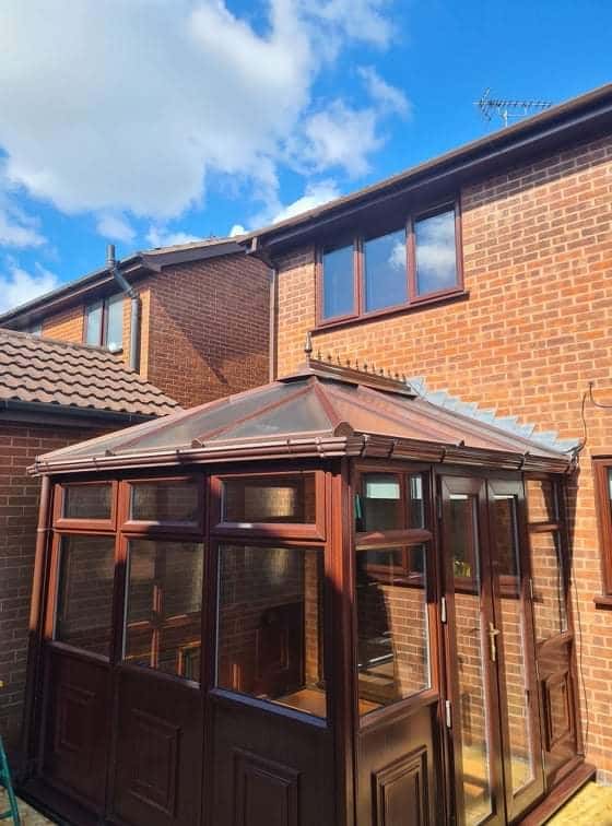 Brown tiled warm-roof conservatory fitted by WeatherTech Roofing
