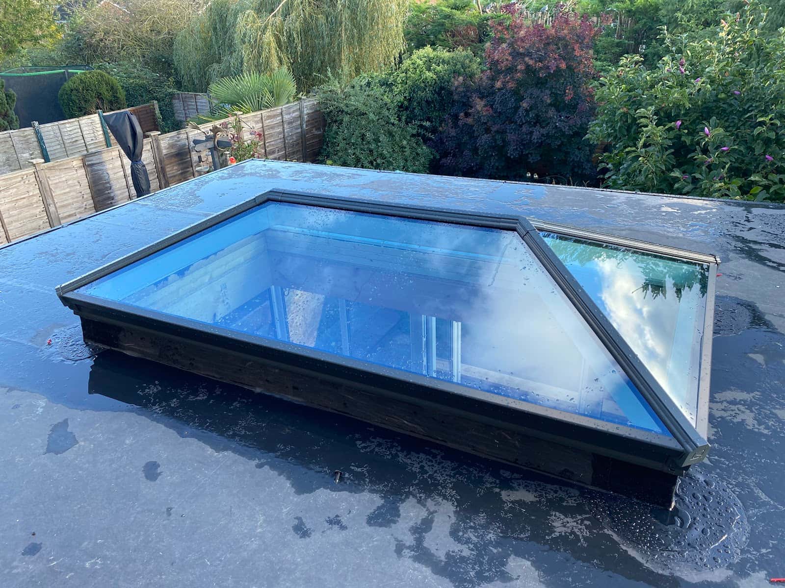 Flat roof with rooflights by WeatherTech Roofing