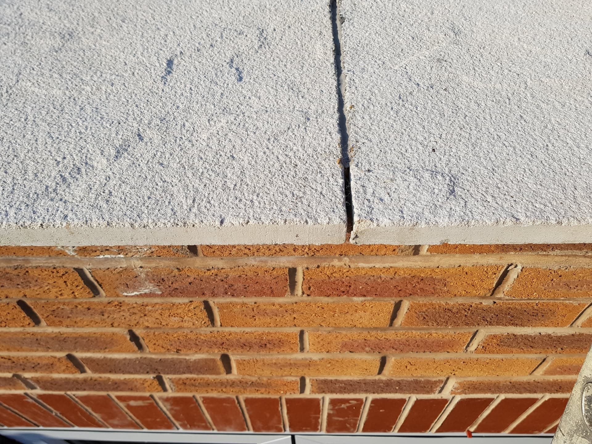 Fascia board and soffit junction with brickwork