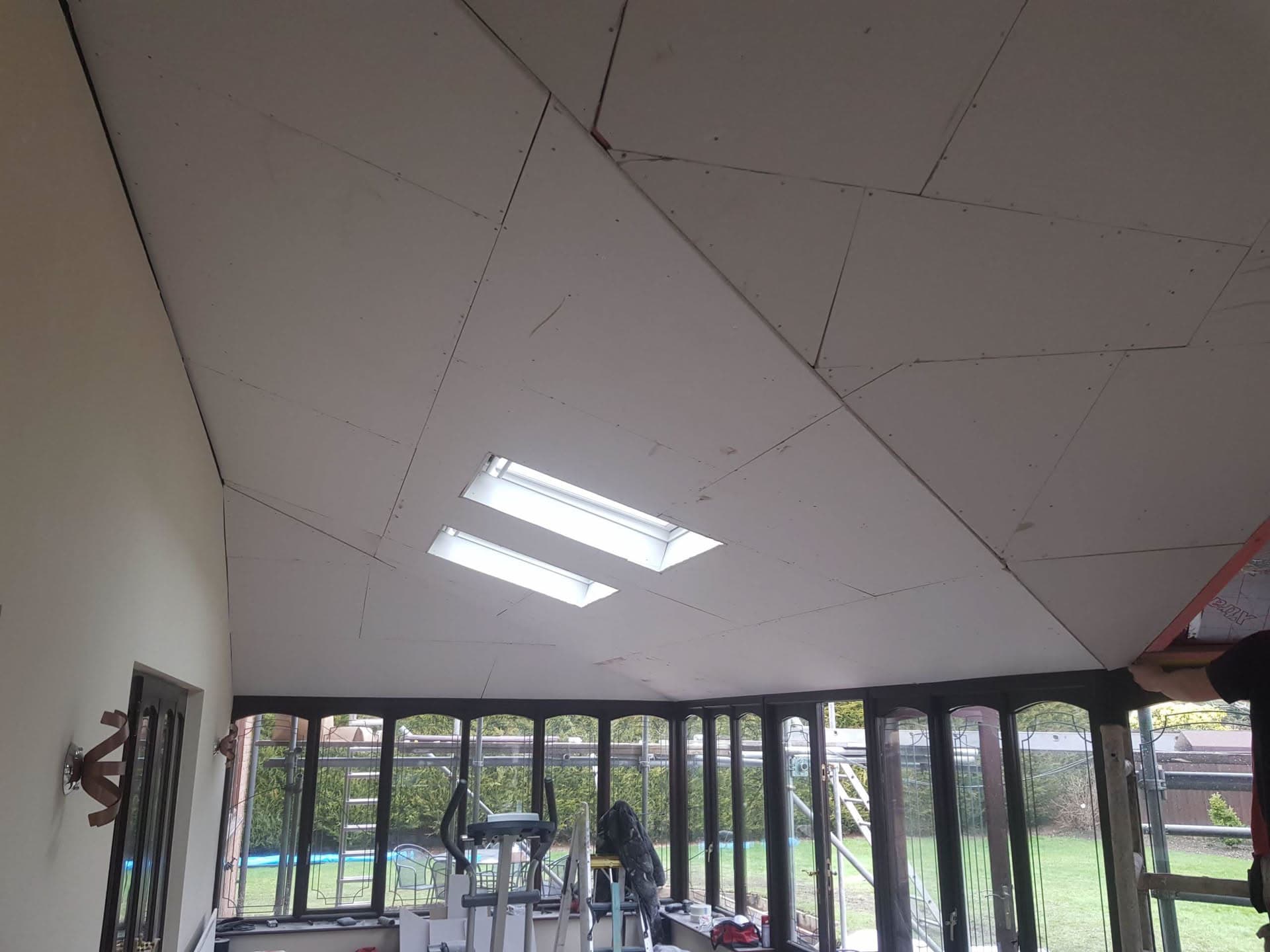 White conservatory ceiling with two rectangular roof lights installed