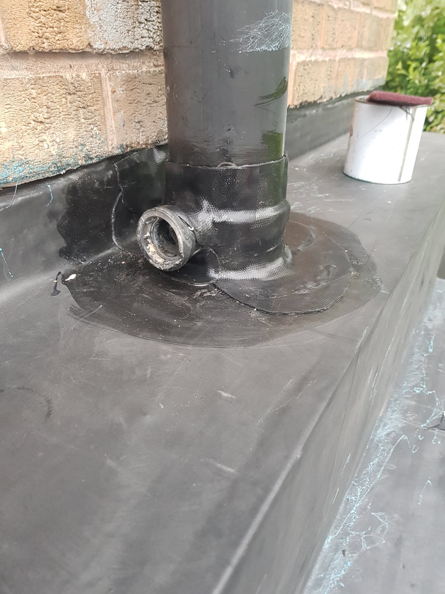 GRP flat roof with pipe flashing detail and waterproofing membrane