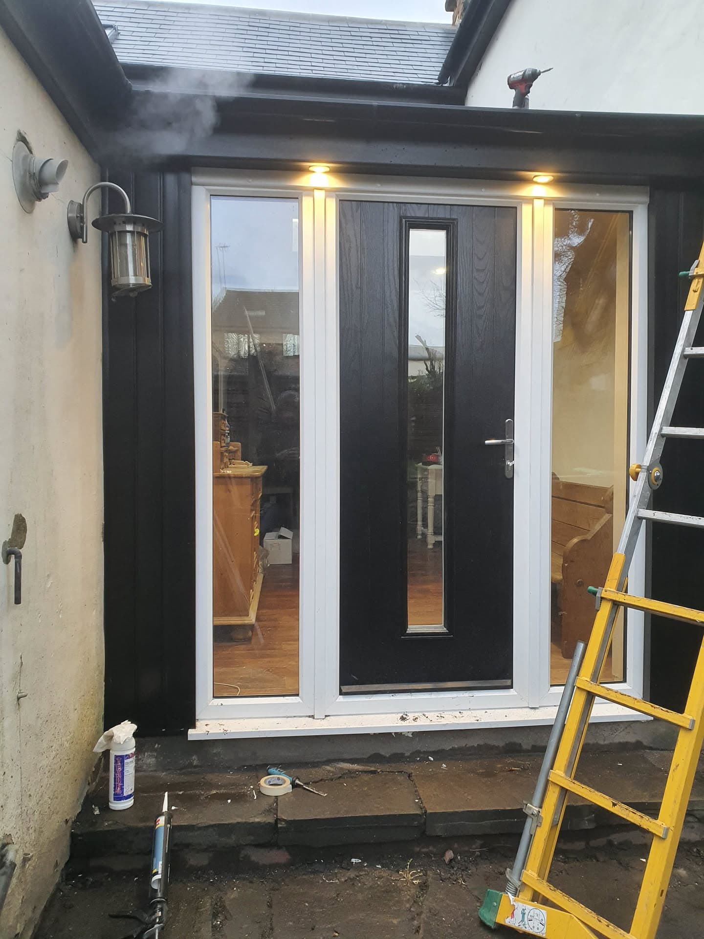 Flat roof extension with anthracite fascias and roof light window