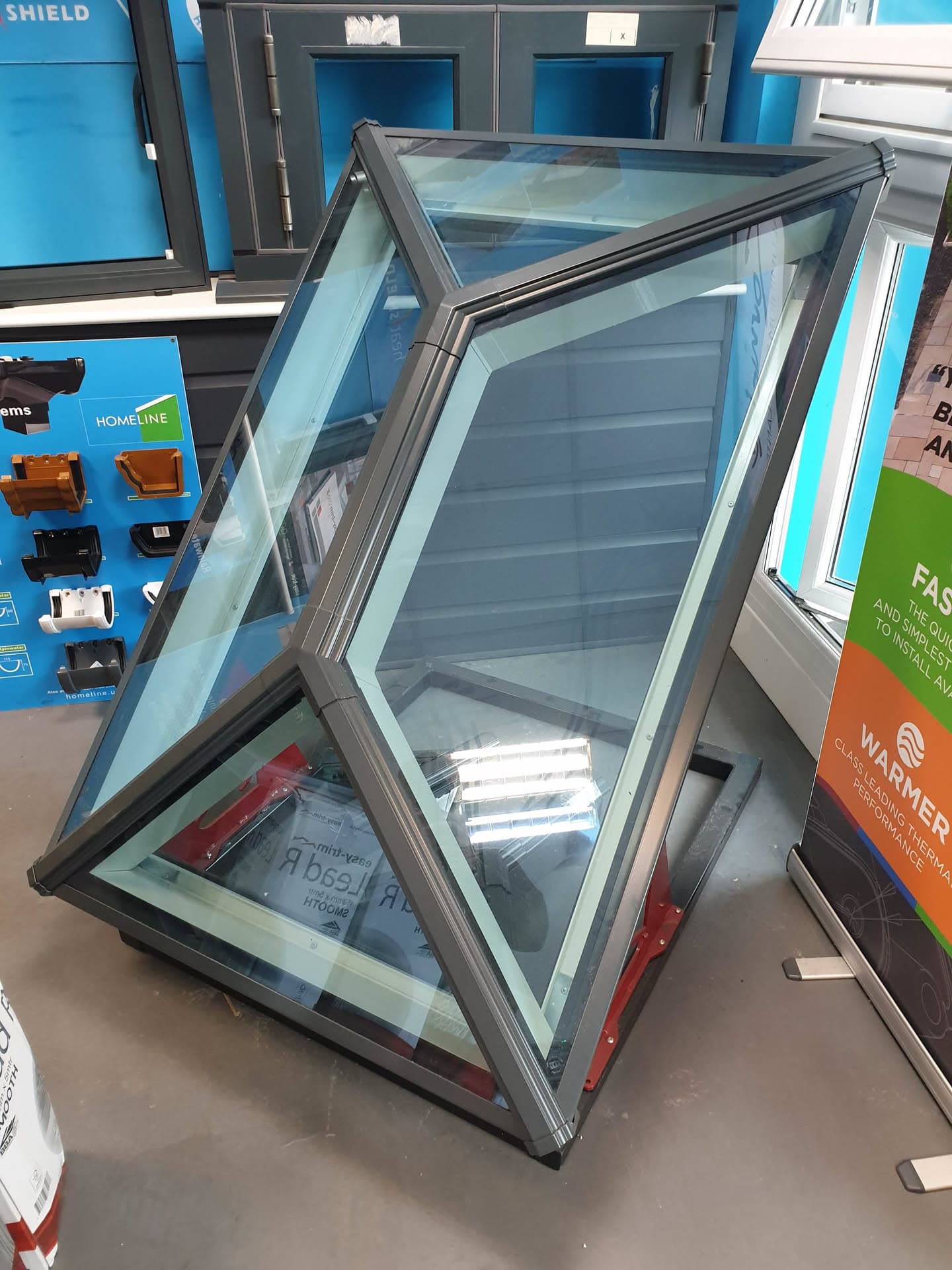 Anthracite grey roof lantern with glazed panels displayed in showroom