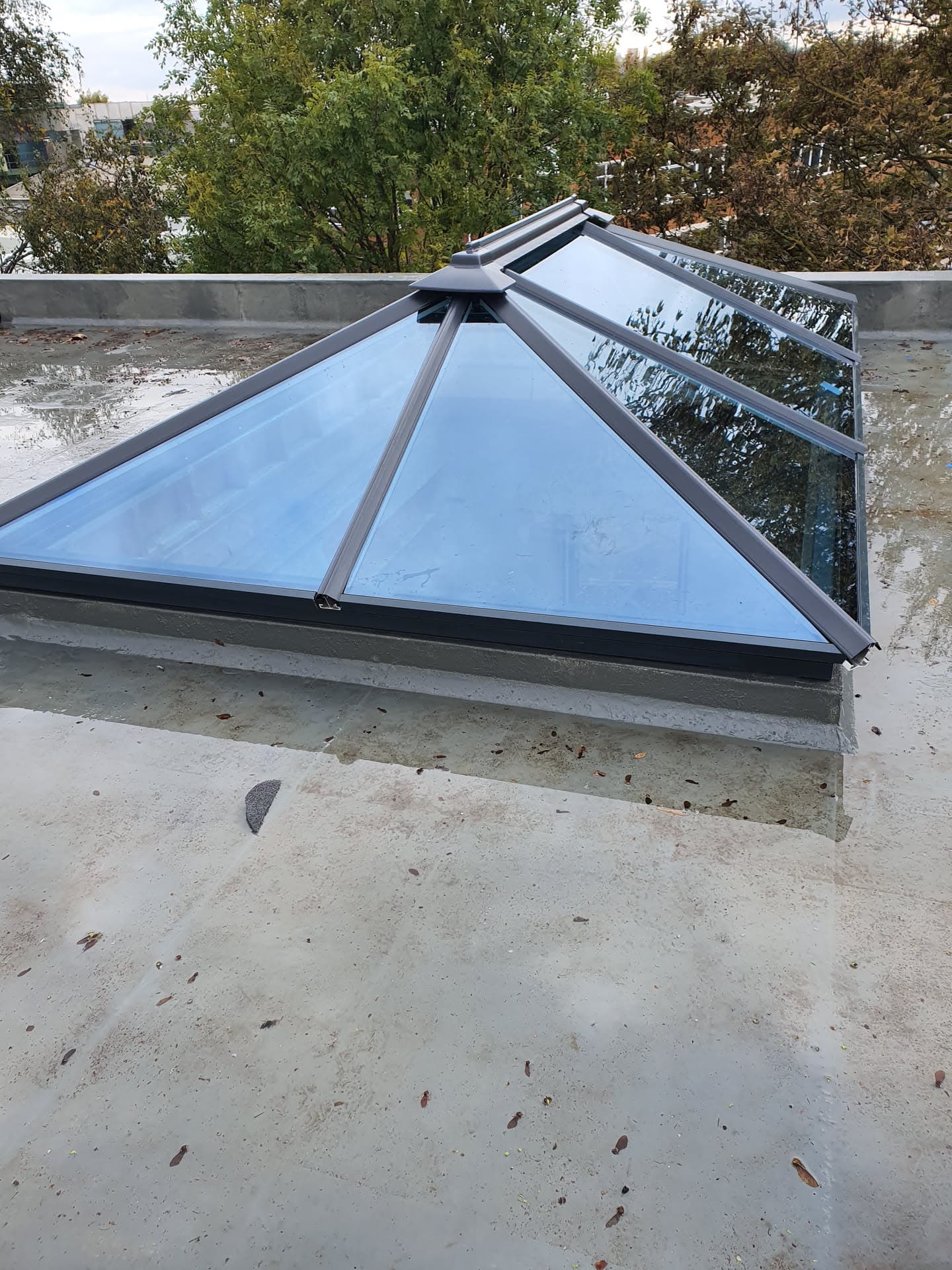 Glazed roof lantern with anthracite frame installed on flat roof