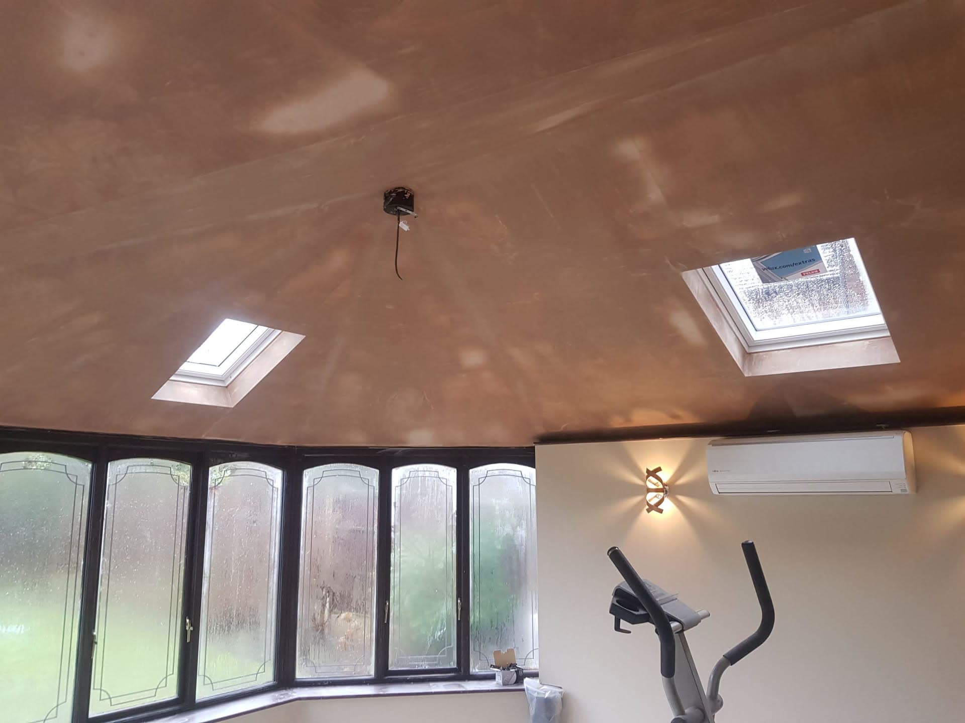 Interior view of vaulted ceiling with two roof windows installed in pitched roof