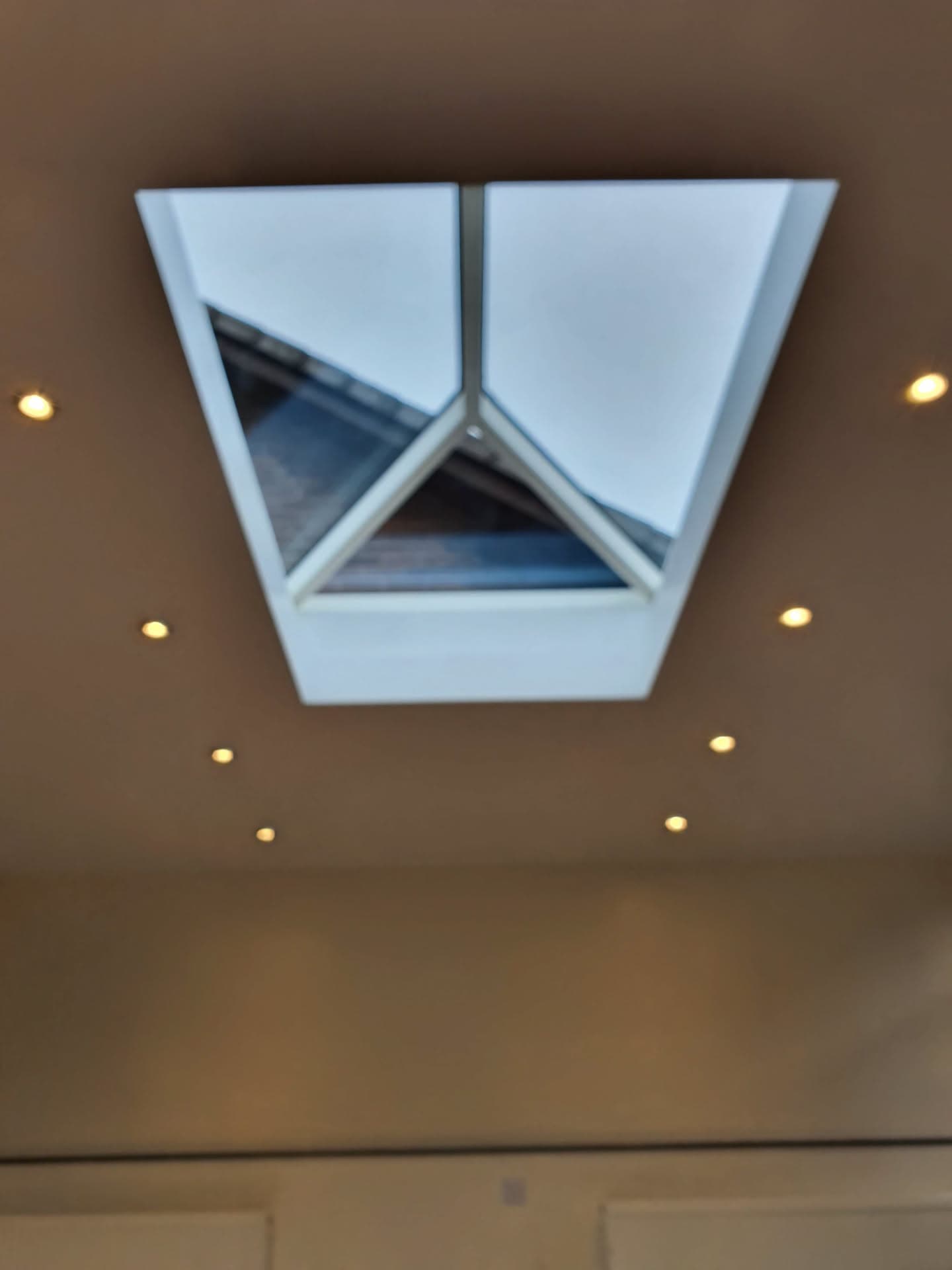 Lantern roof light with white uPVC frame and glazed panels viewed from inside