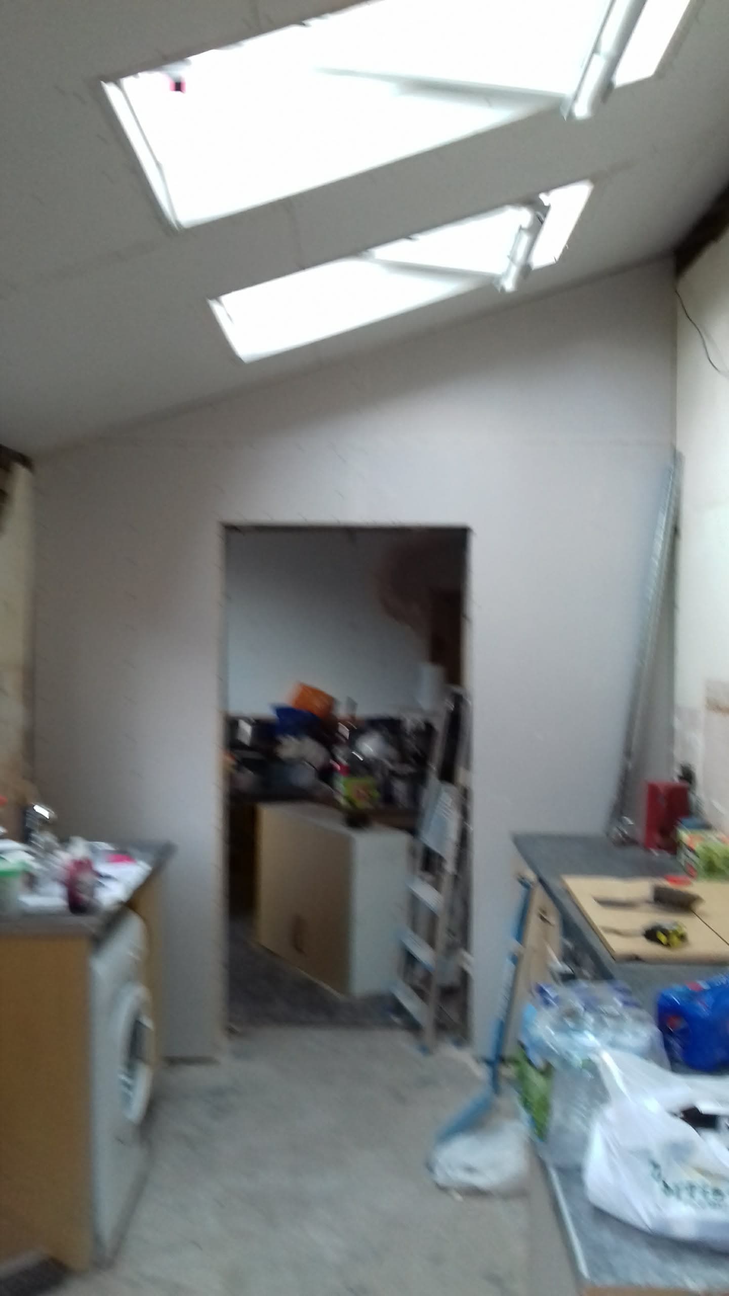 Interior view of room with two roof windows installed in flat ceiling