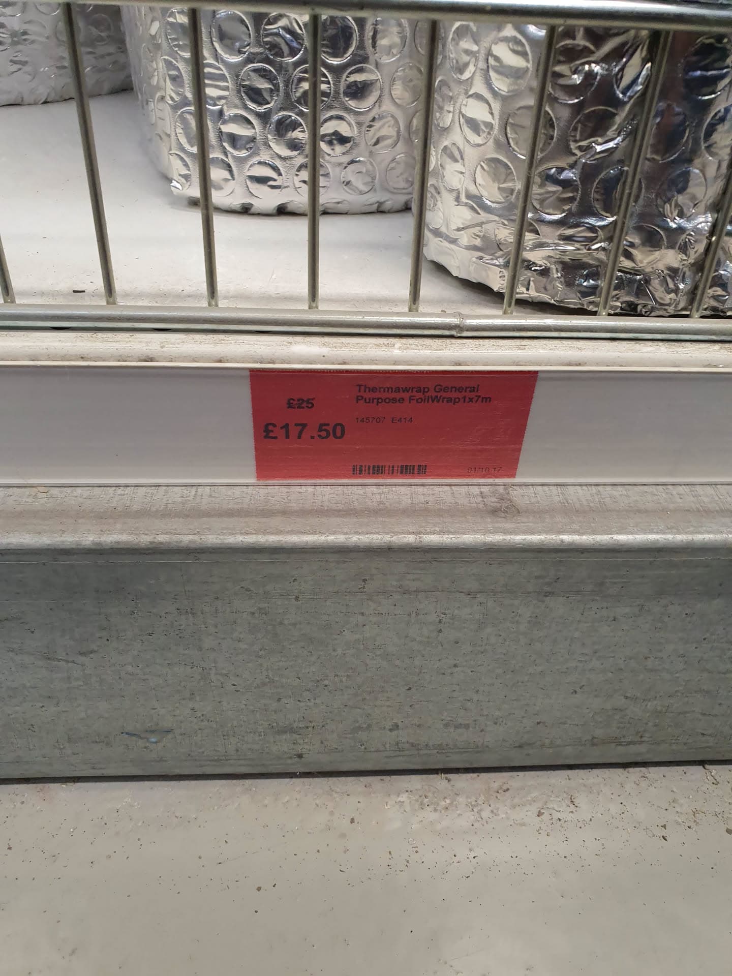Rolls of thermal insulation foil wrap on a shop shelf with price label