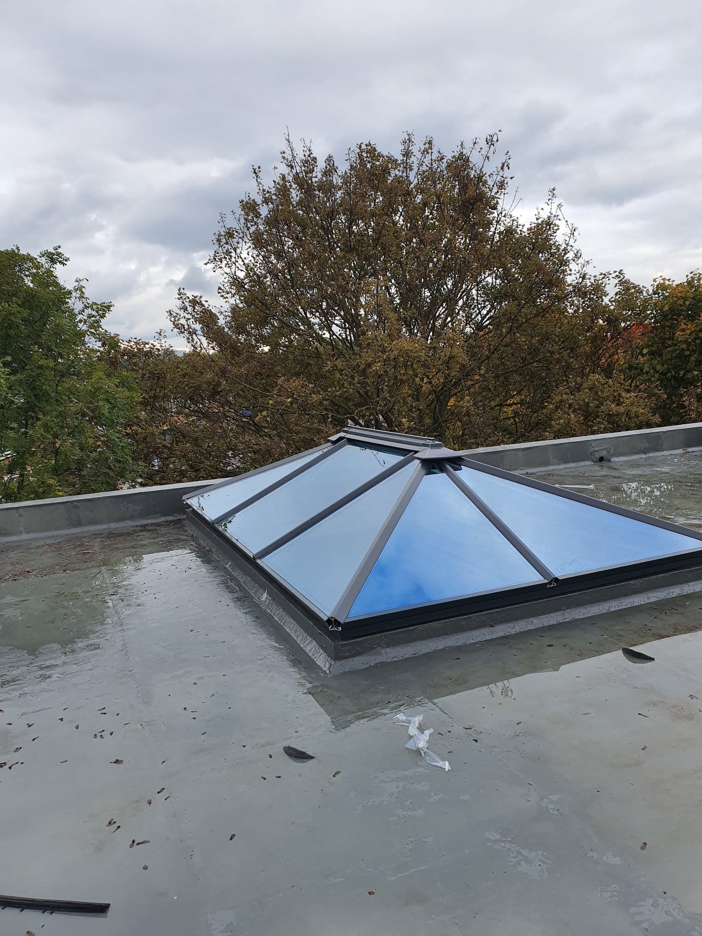 Flat roof with grey GRP finish and glazed roof lantern with anthracite frame