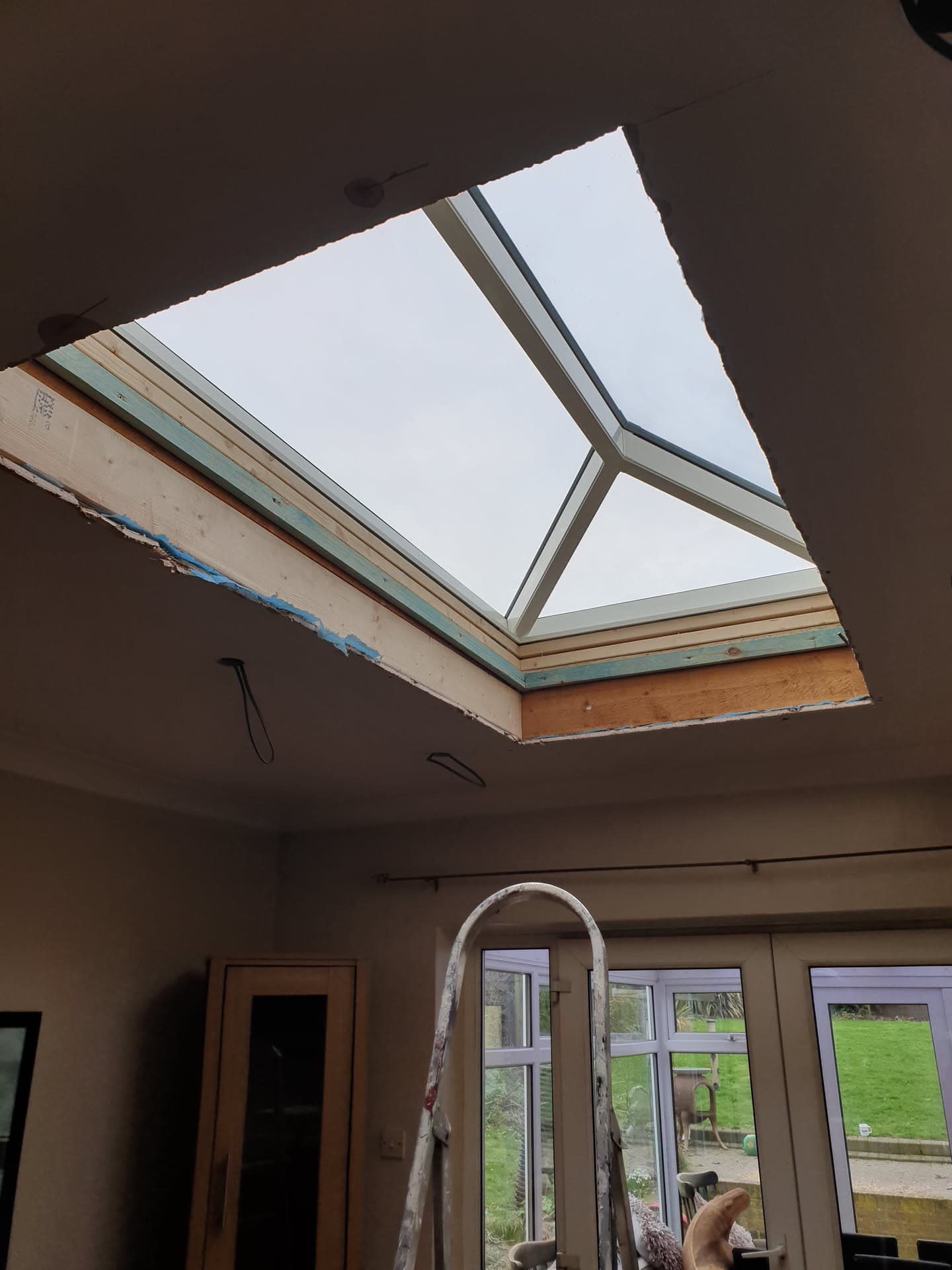 Newly installed roof lantern with timber frame and glazing viewed from inside