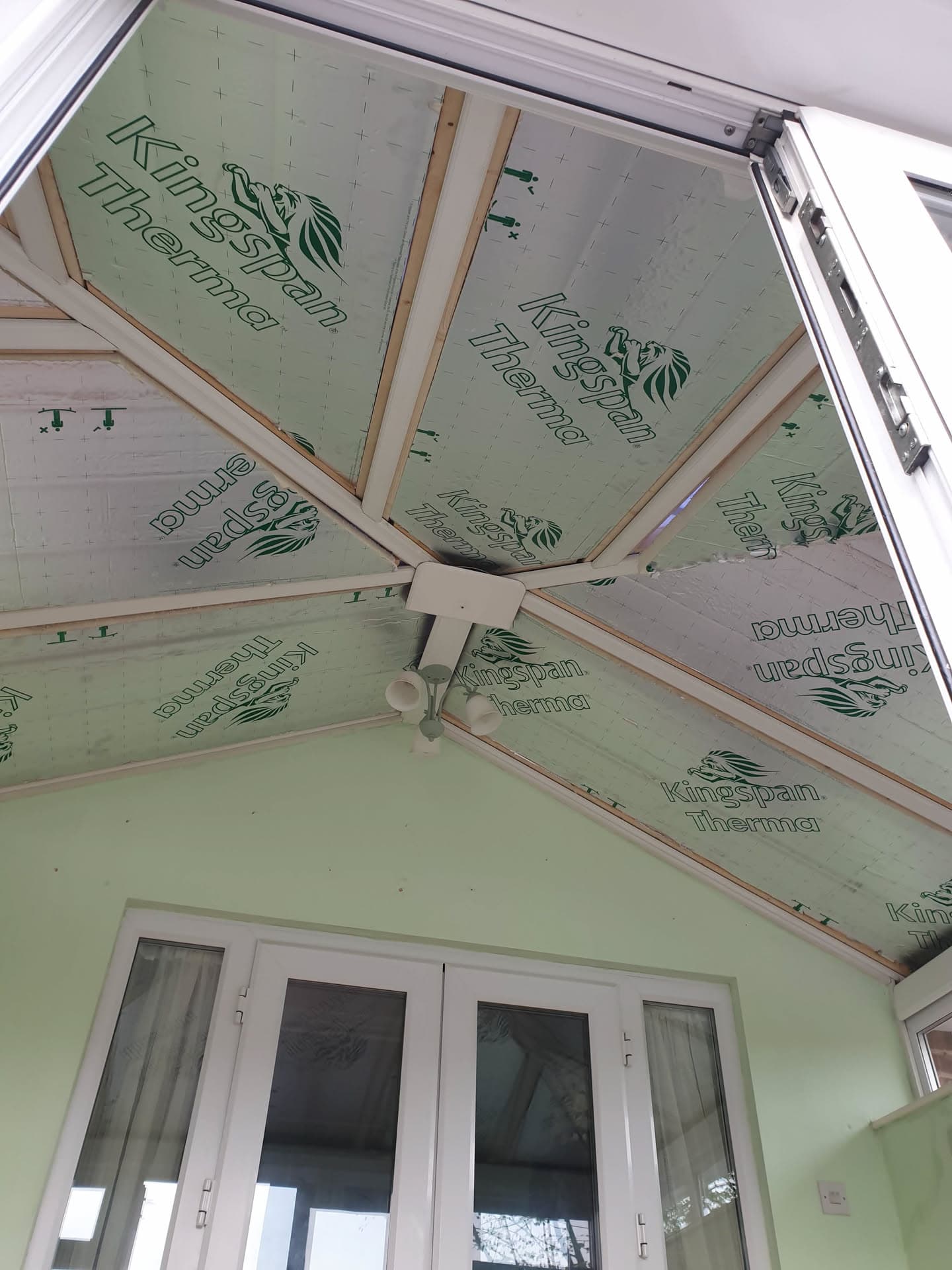 Conservatory roof under construction with Kingspan Therma insulation boards and timber battens