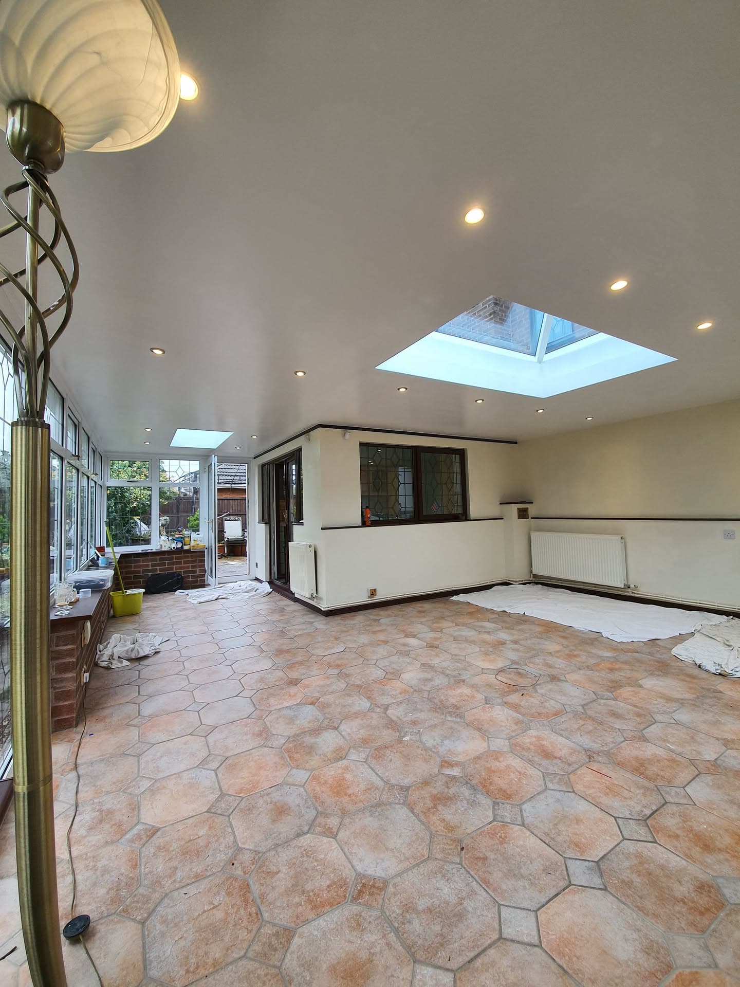 Interior view of conservatory extension with two roof lanterns and recessed ceiling lights