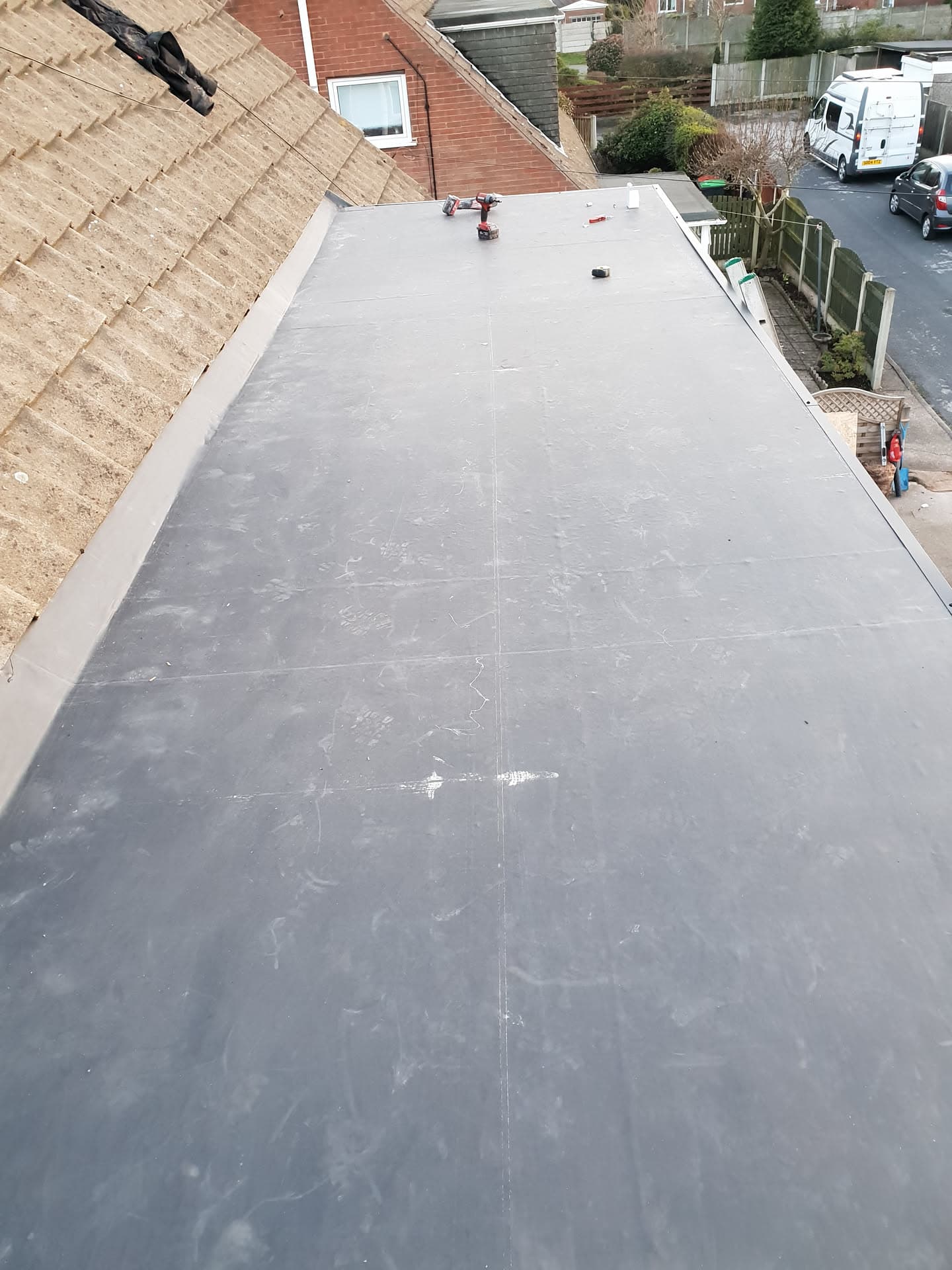 Grey flat roof with GRP fibreglass finish on residential extension