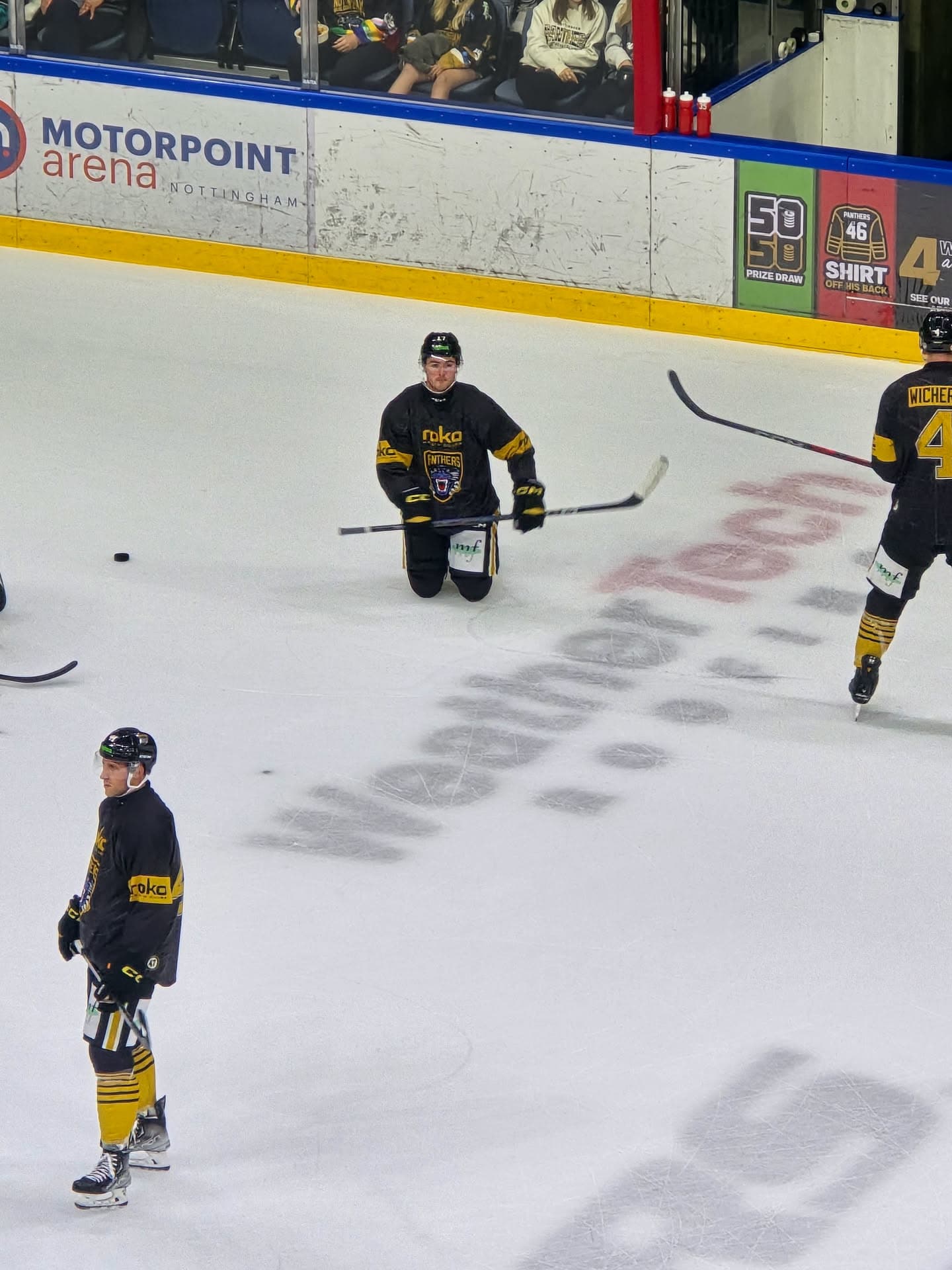 Nottingham Panthers player warming up over the WeatherTech logo on the ice