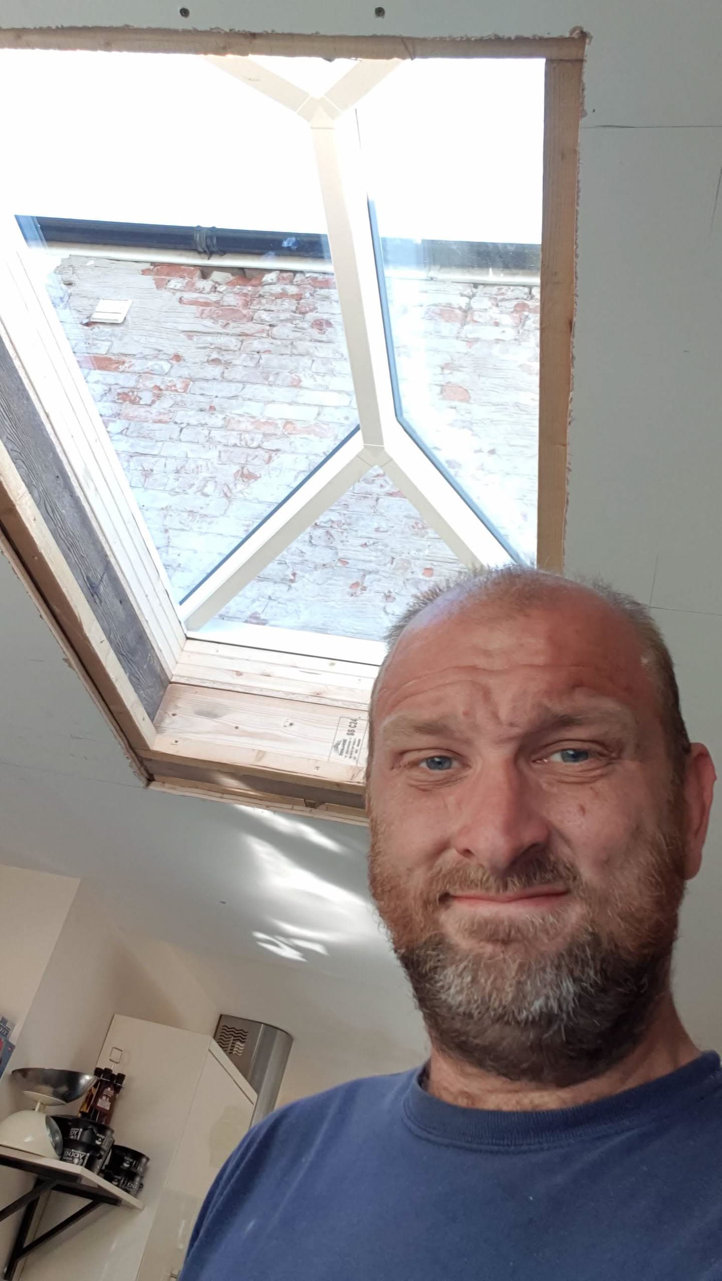 WeatherTech fitter installing new roof window with white frame