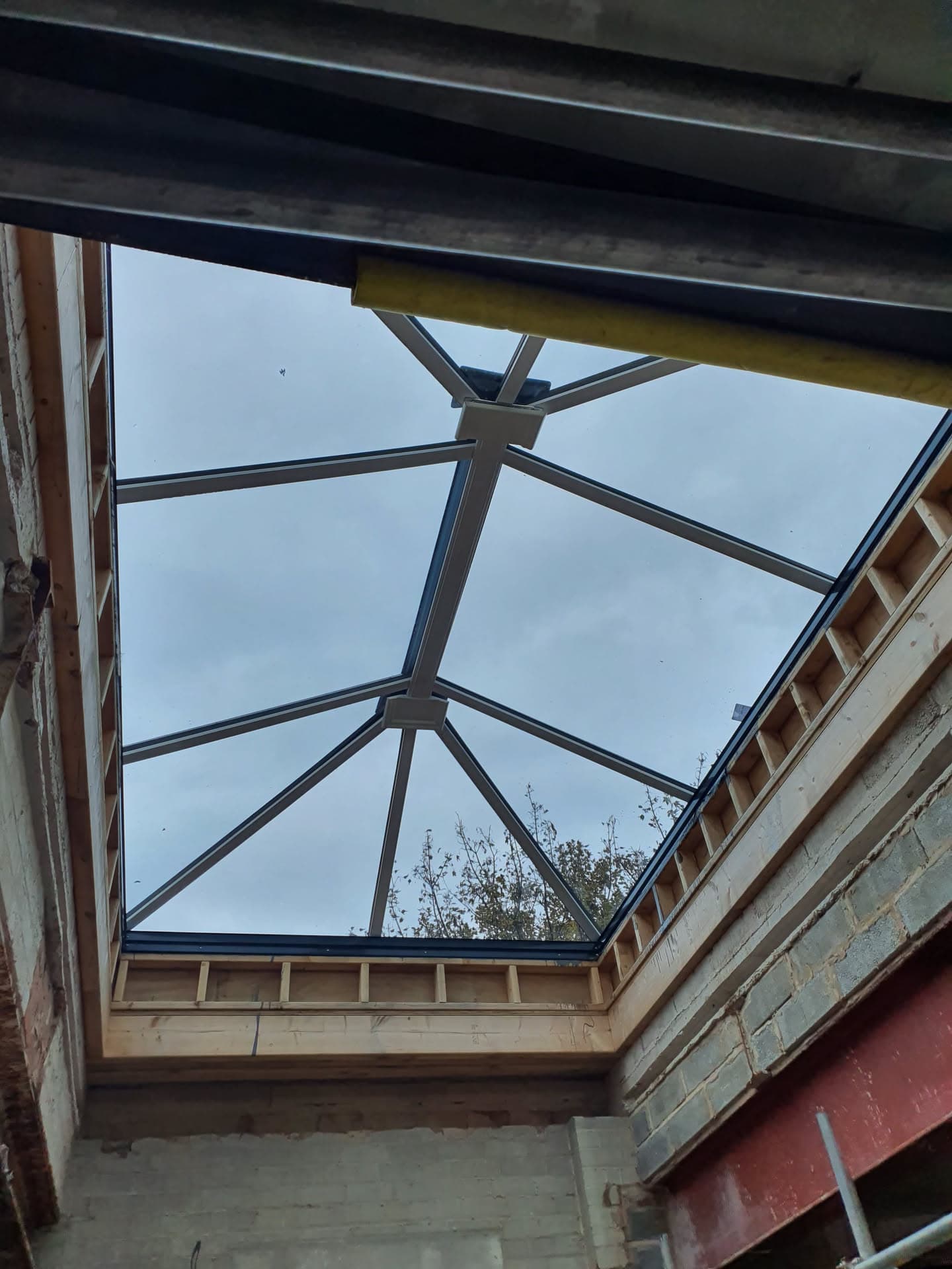 Glazed conservatory roof with anthracite aluminium framework and glass panels