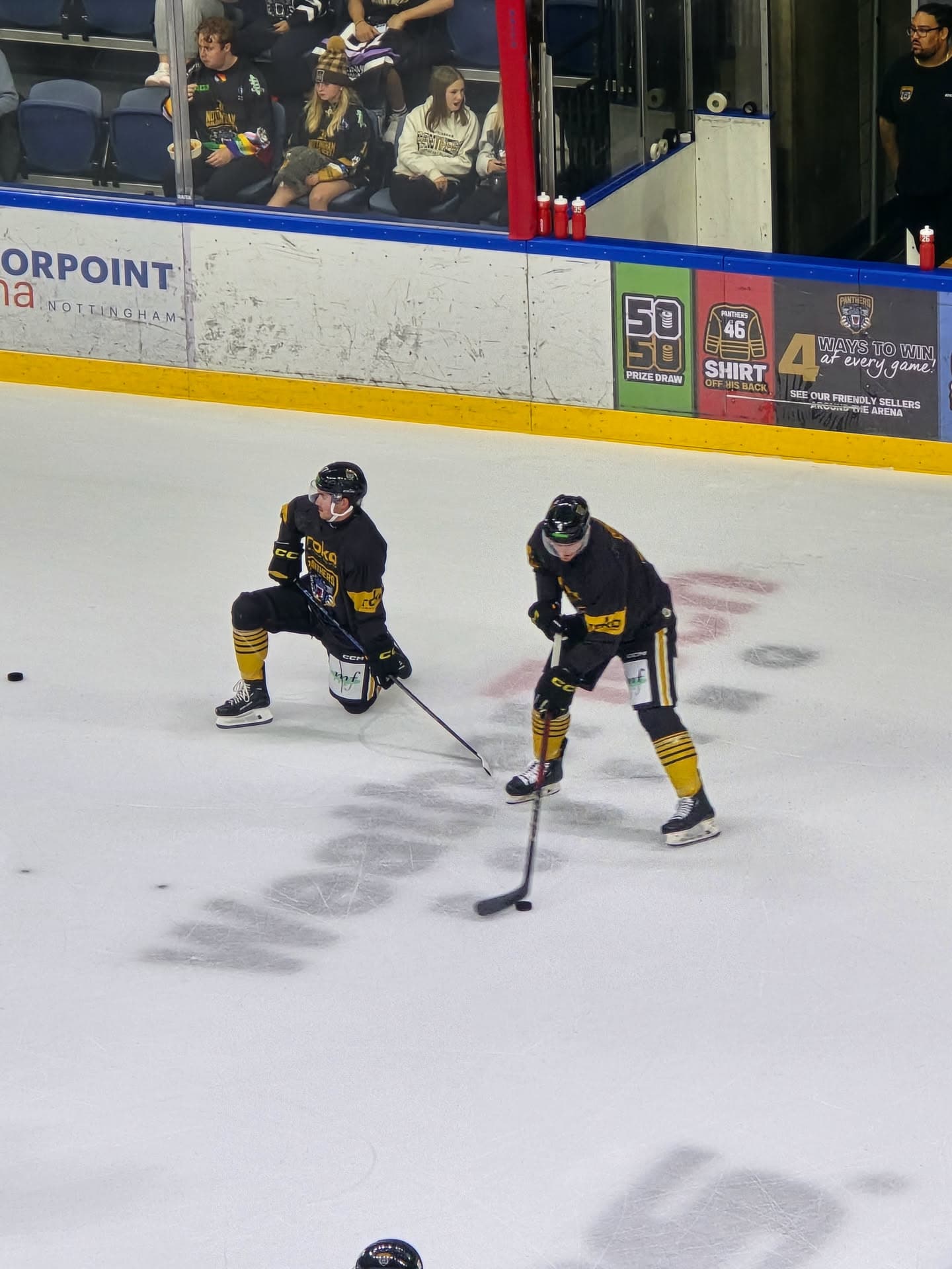 Two Nottingham Panthers players in the warm-up before a home game
