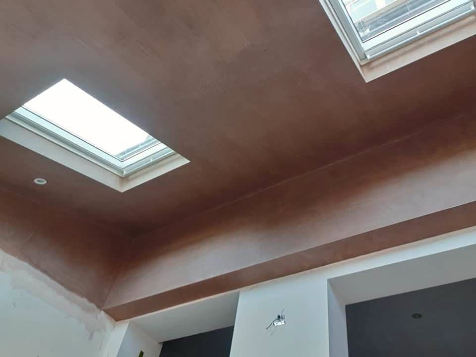 Interior view of vaulted ceiling with two roof windows installed