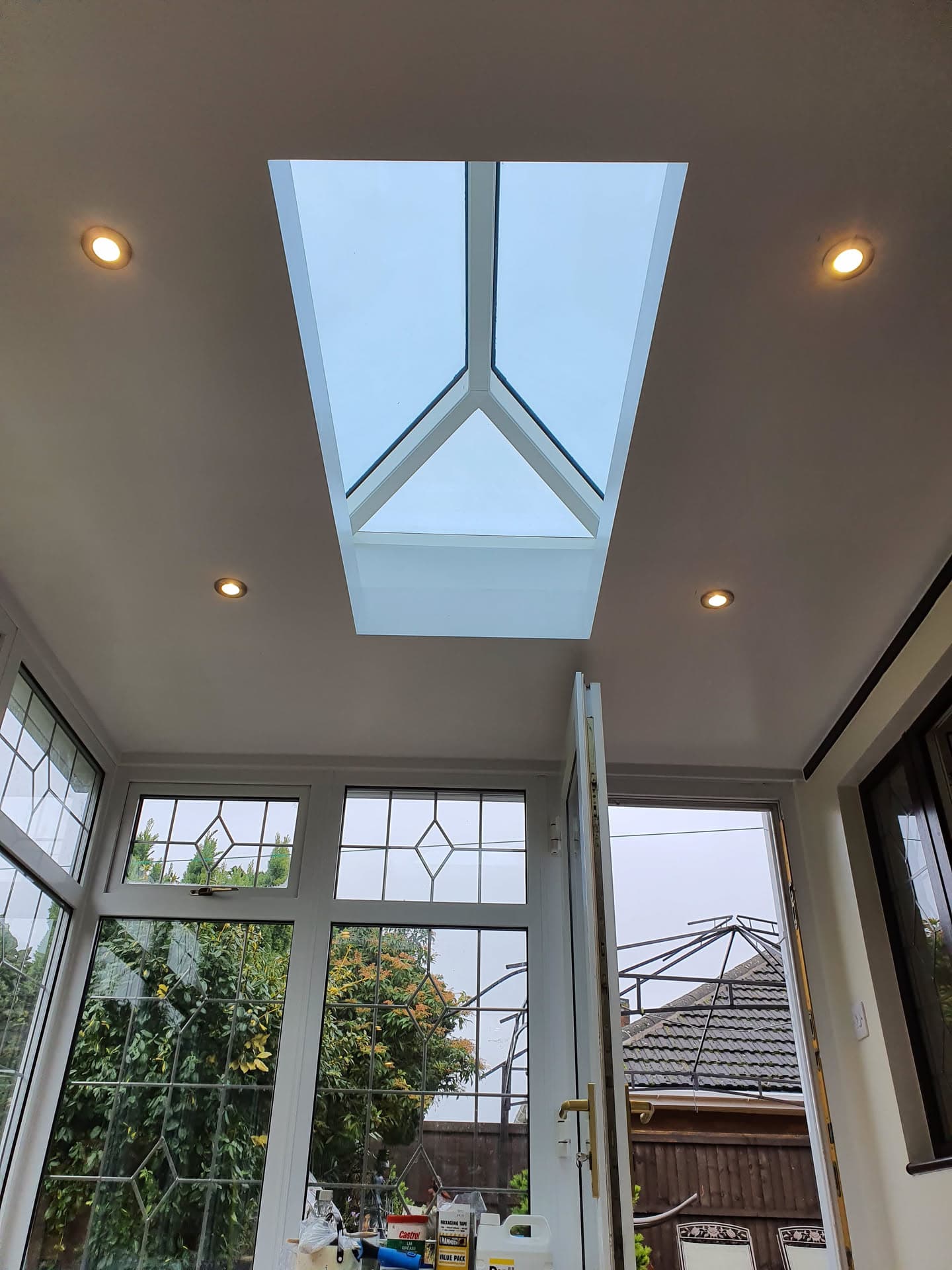 Interior view of conservatory roof lantern with white uPVC frame and glazed panels