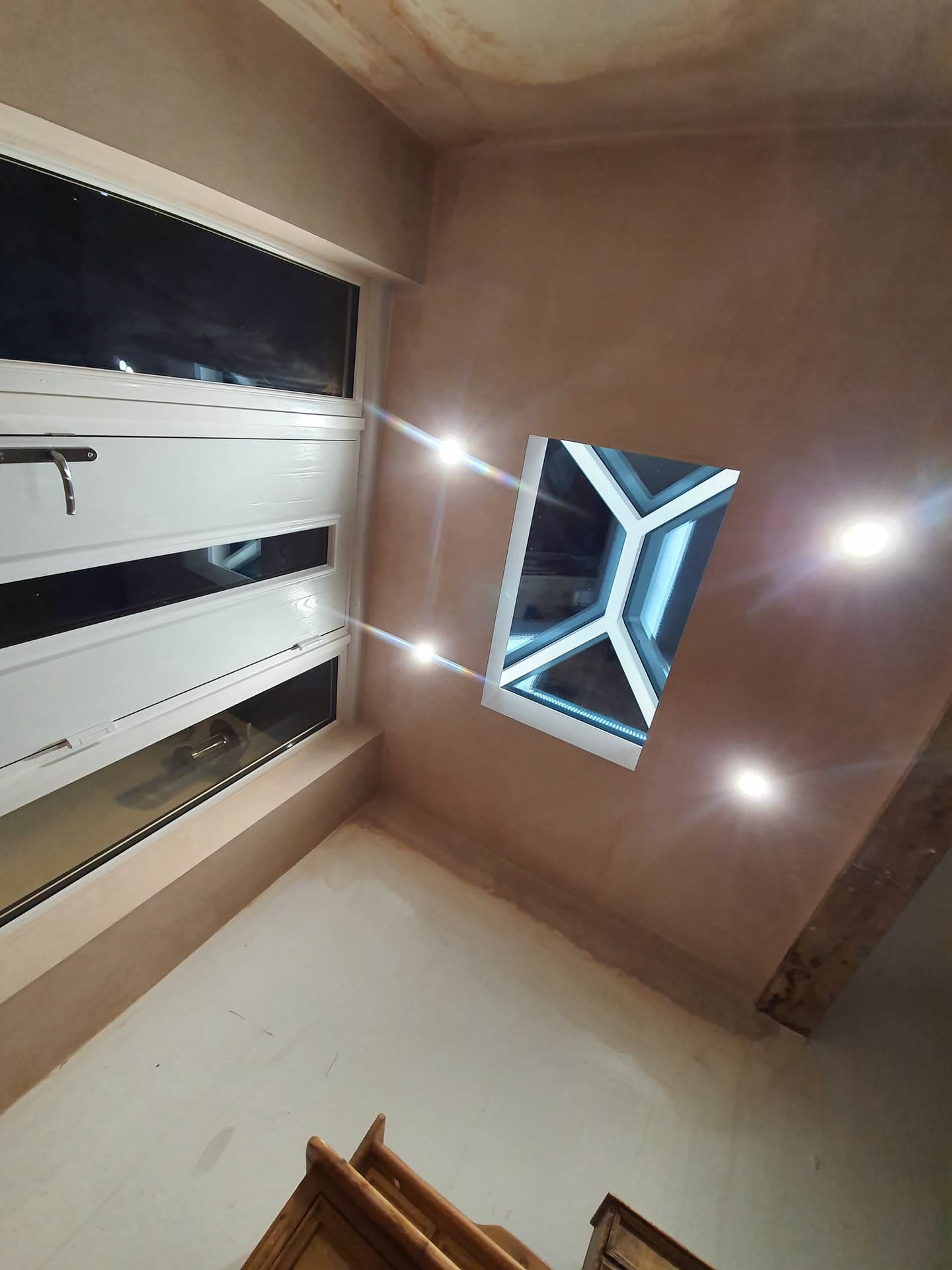 Interior view of flat roof with lantern skylight and integrated LED lighting