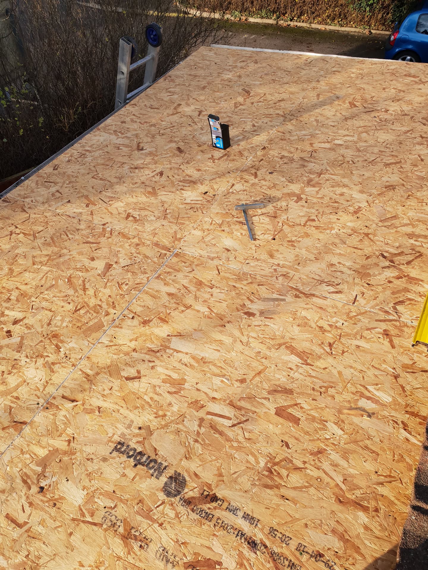 Flat roof covered with OSB boarding ready for waterproof membrane installation