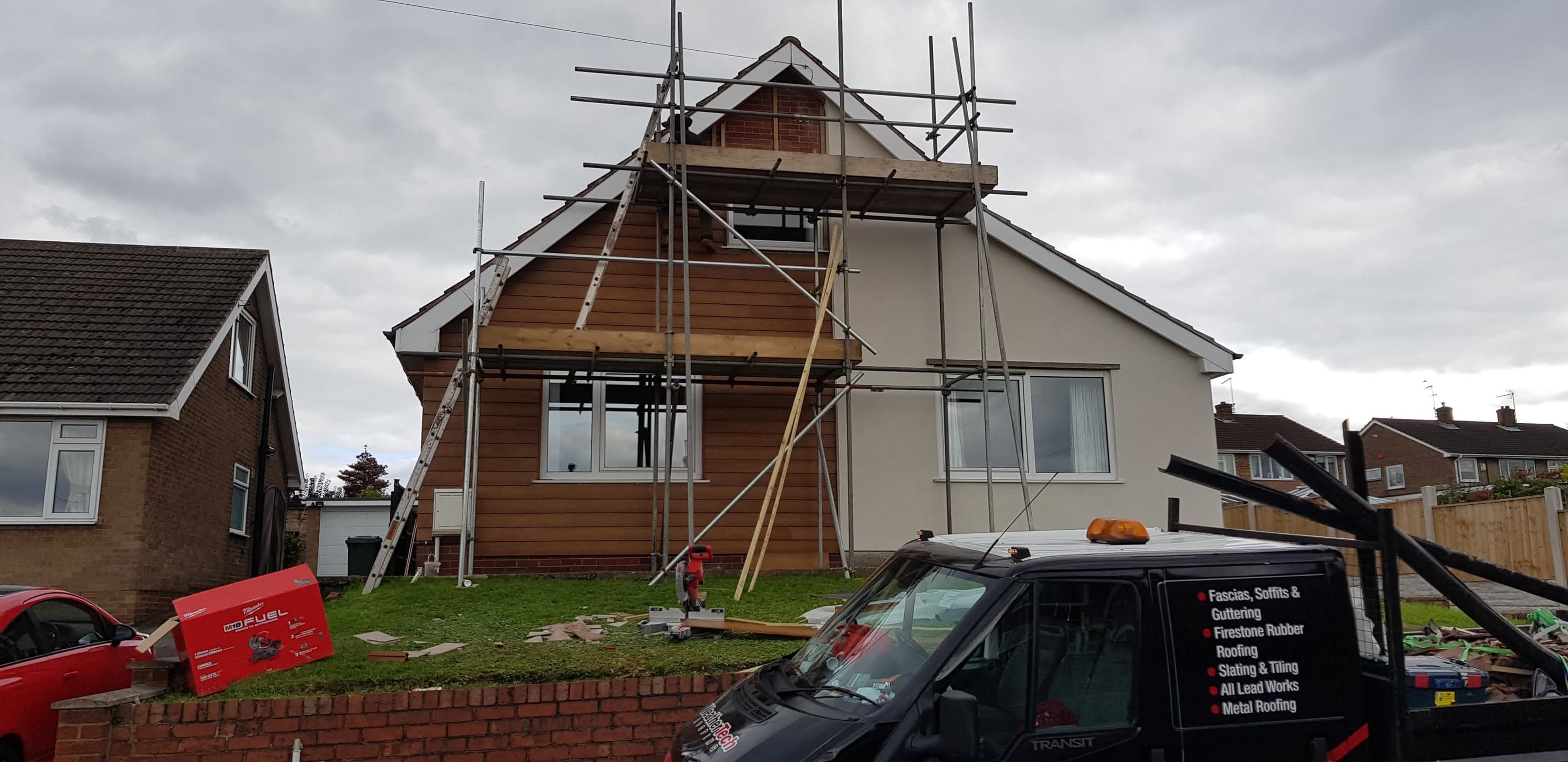 Pitched roof with scaffolding during renovation work on detached house