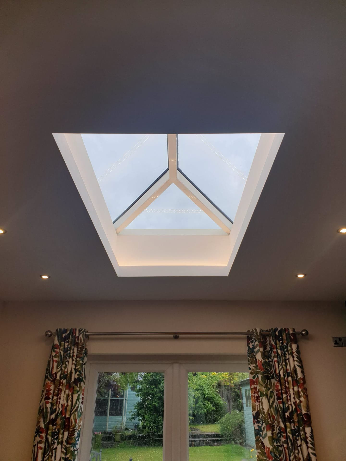 Interior view of lantern roof light with white frame and glazed panels