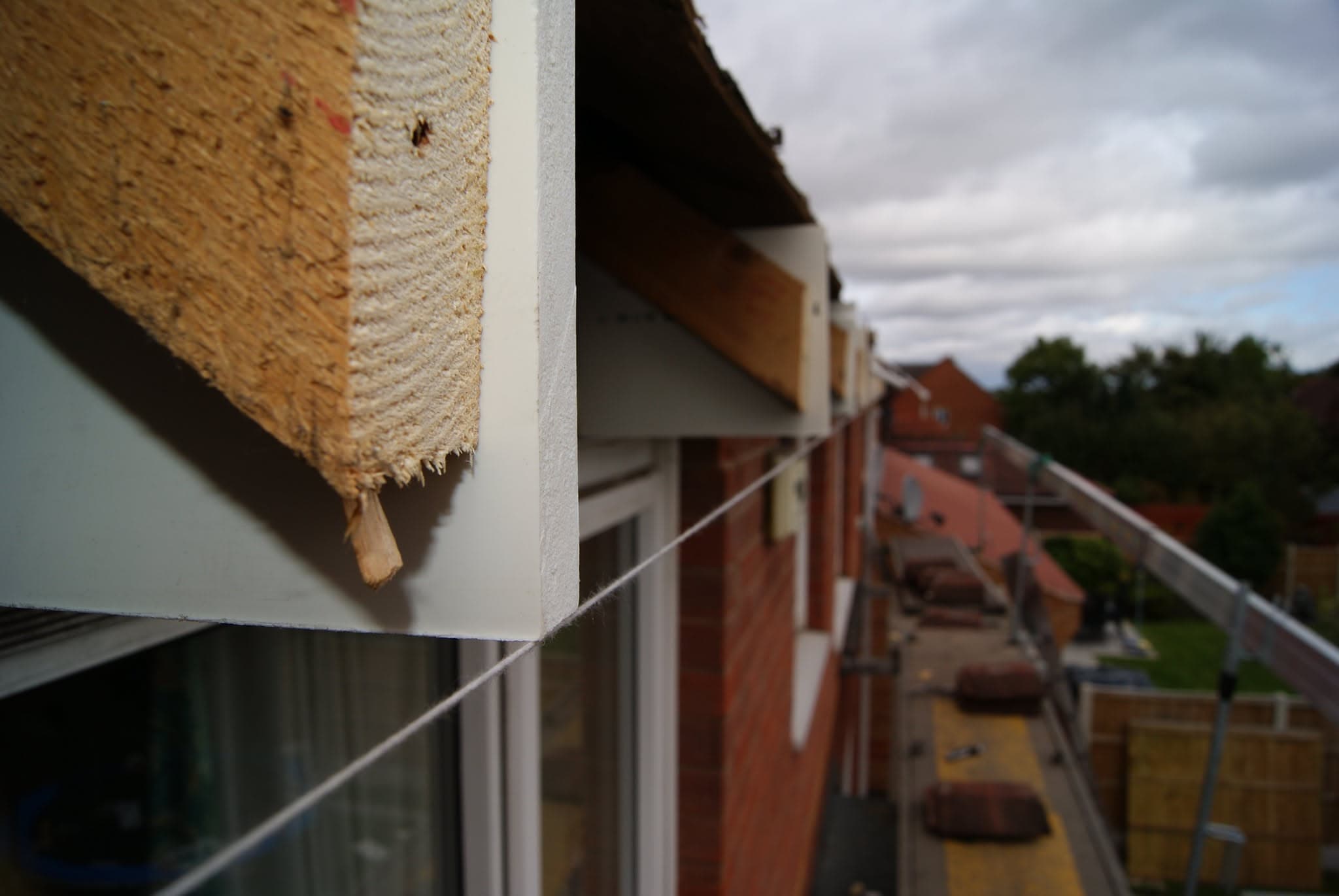 White fascia board and soffit installation on residential property