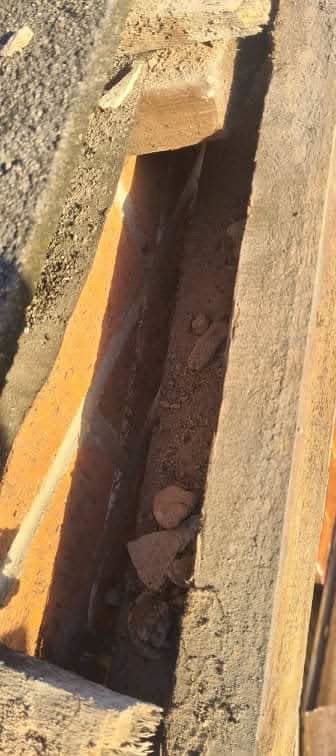 Deteriorated chimney flashing and mortar requiring repair