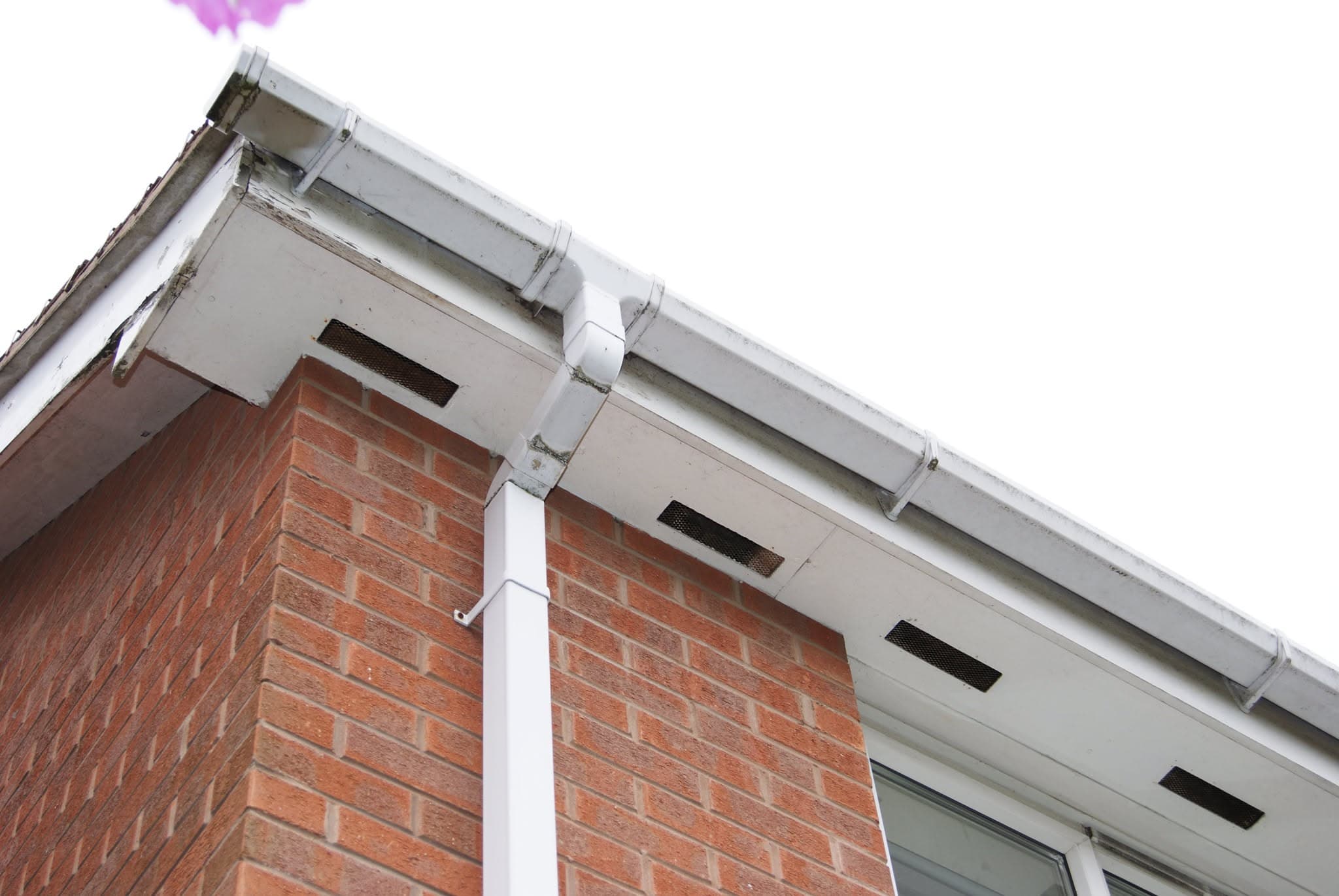 White UPVC fascias, soffits and guttering installed on red brick house