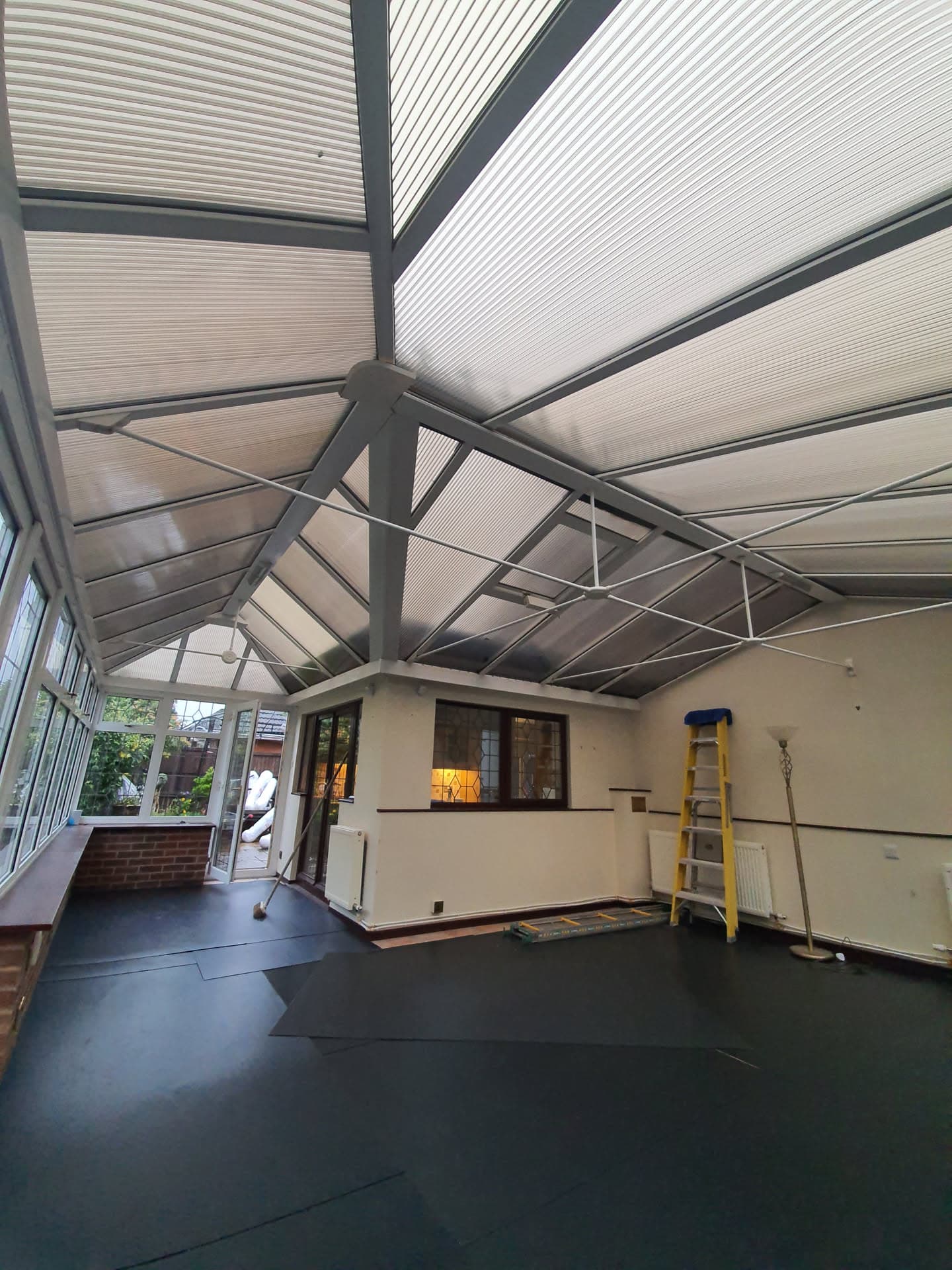 Interior view of conservatory with anthracite frame and polycarbonate roof panels