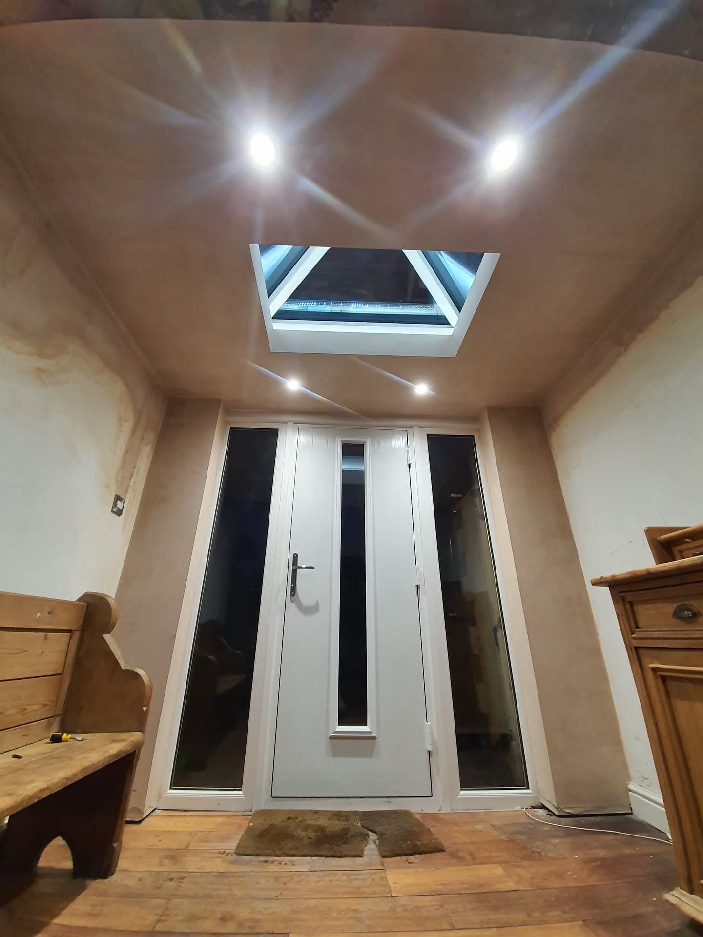 Interior view of entrance hallway with roof lantern skylight and recessed ceiling spotlights