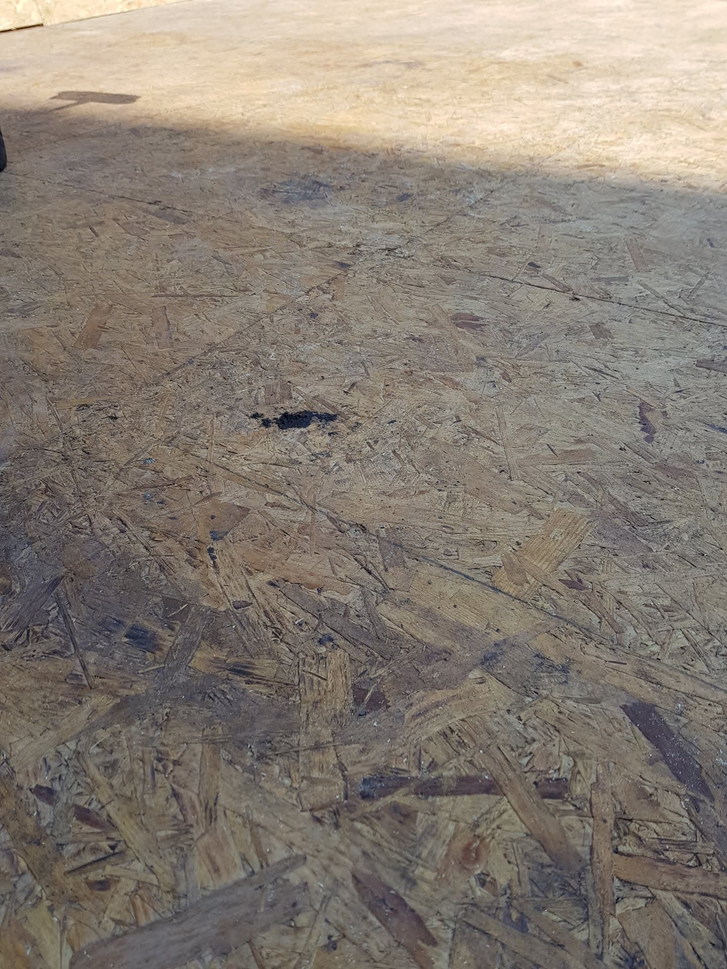 OSB boarding on flat roof deck ready for waterproof membrane installation