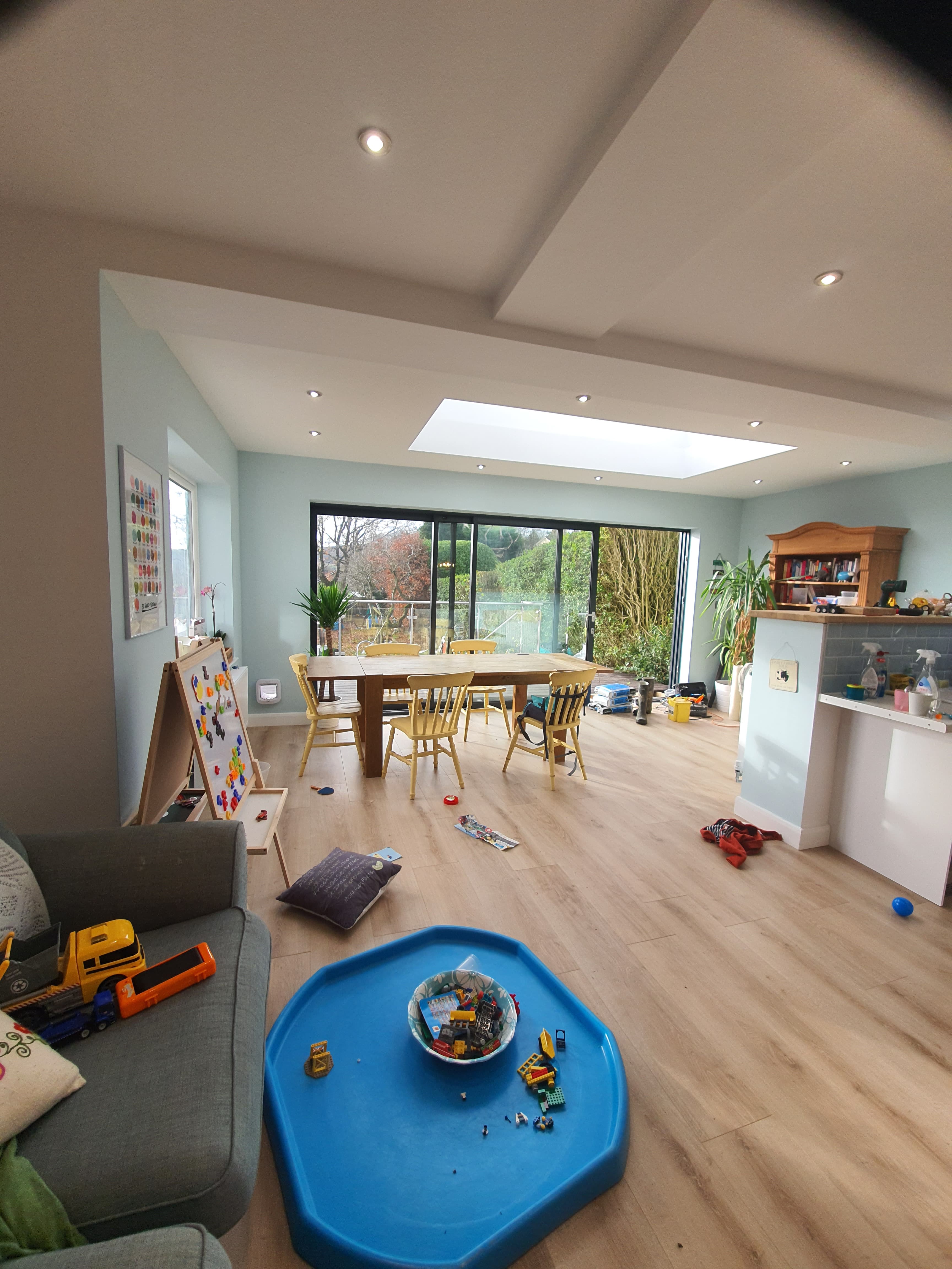 Interior view of kitchen extension with flat roof skylight and recessed spotlights
