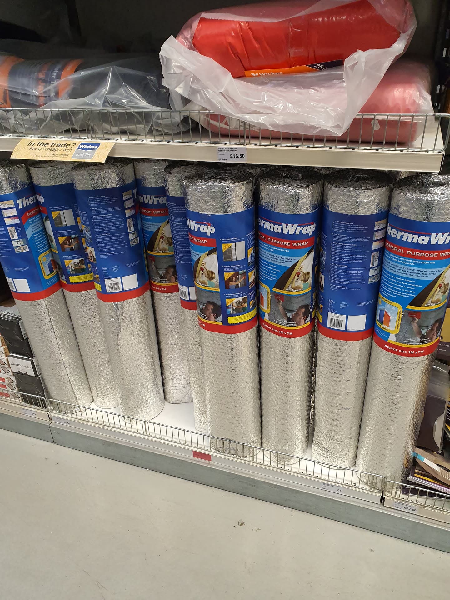 Rolls of thermal insulation wrap displayed on store shelves
