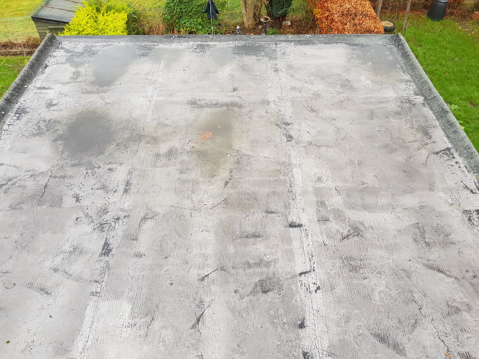 Grey flat roof with GRP fibreglass surface on residential extension