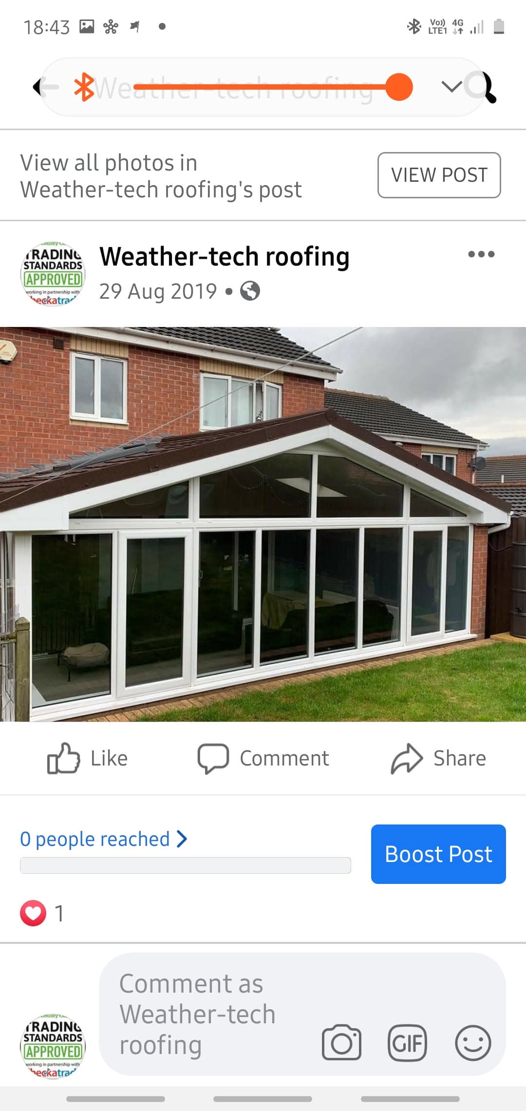 White uPVC conservatory with dark tiled pitched roof on brick house