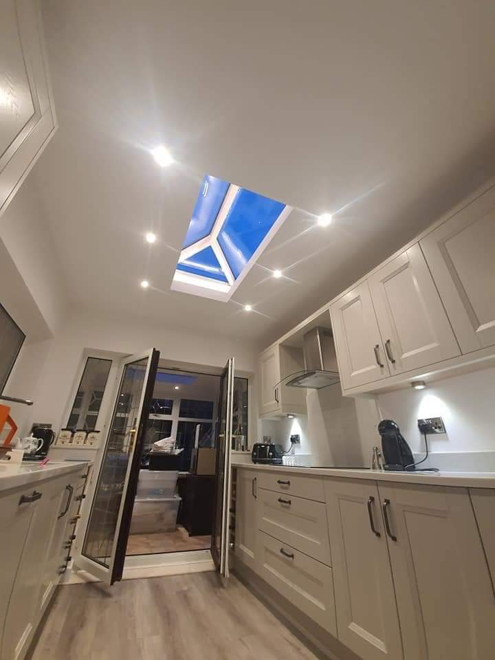 Kitchen interior with roof lantern skylight and recessed ceiling spotlights