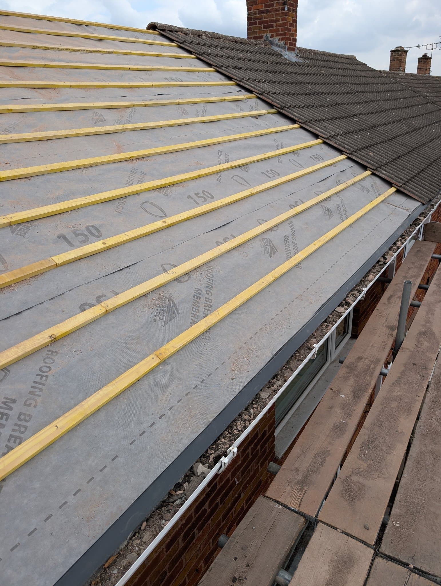 Roof covered in breathable membrane with new treated timber battens, new fascia and guttering fitted